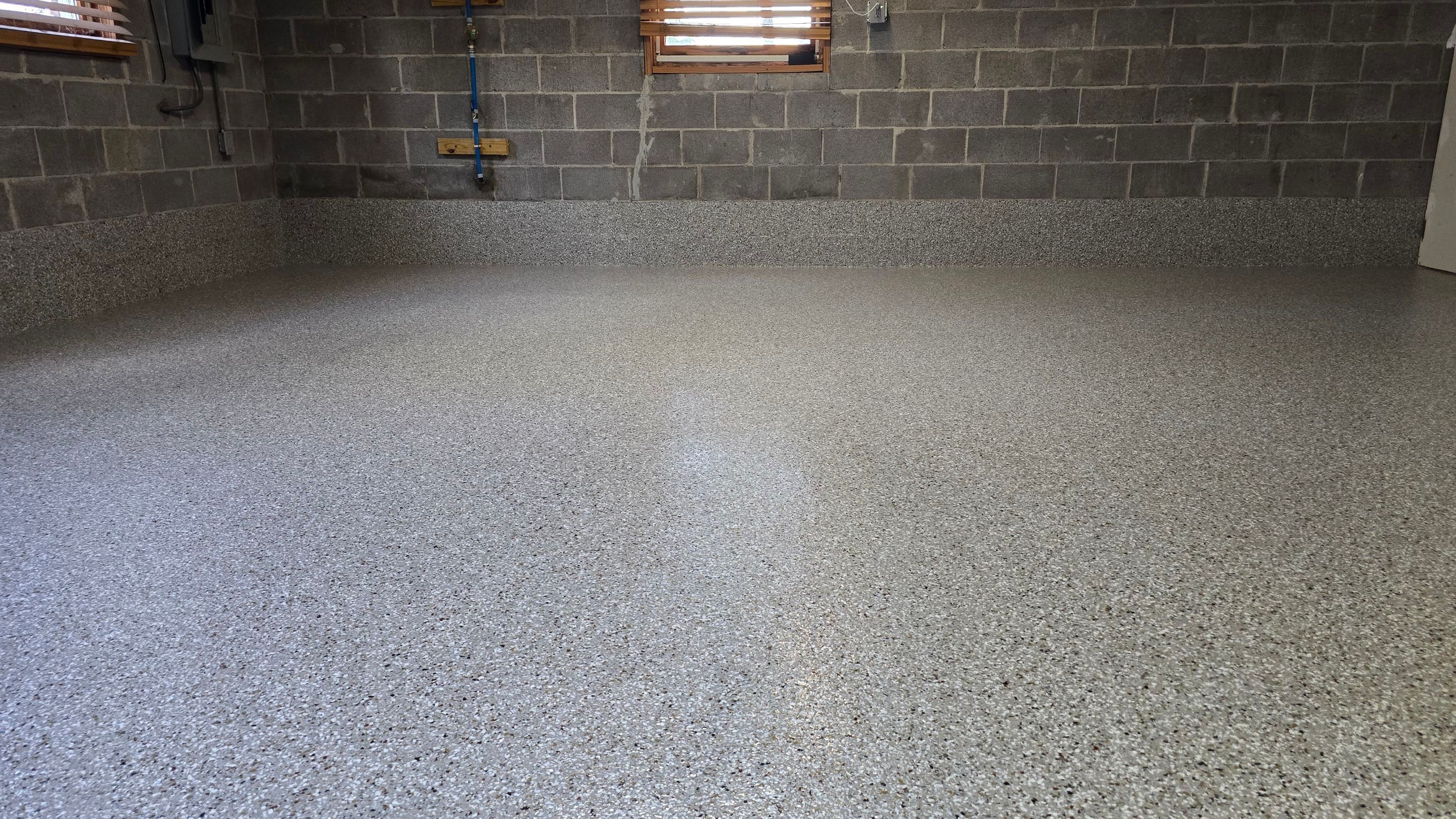 Garage & Porch Using Creekbed by Elite Floor Solutions