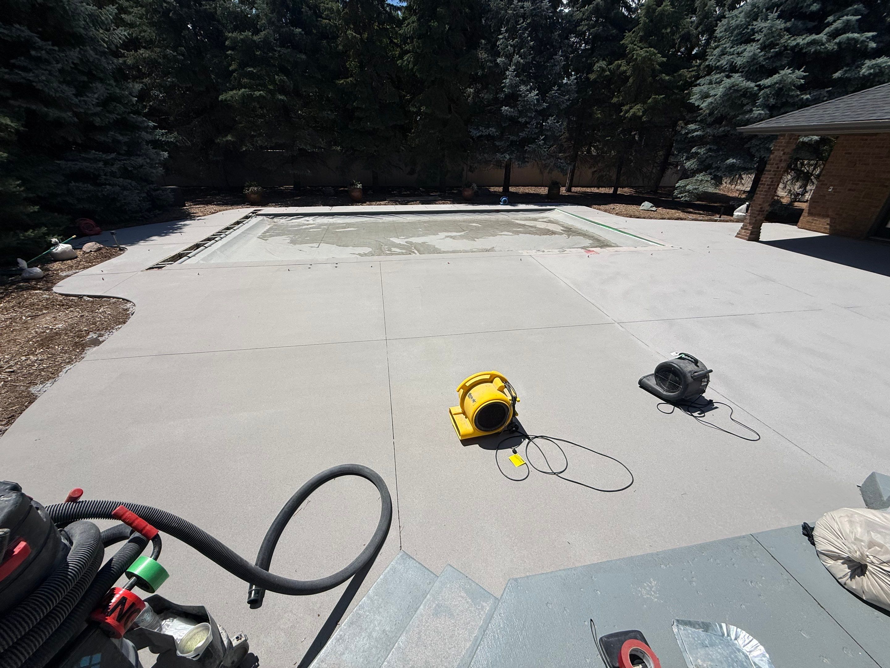 Decorative Concrete Pool Deck and Patio Resurfacing in Sioux Falls by Select Painting, Coatings & Garage Cabinets