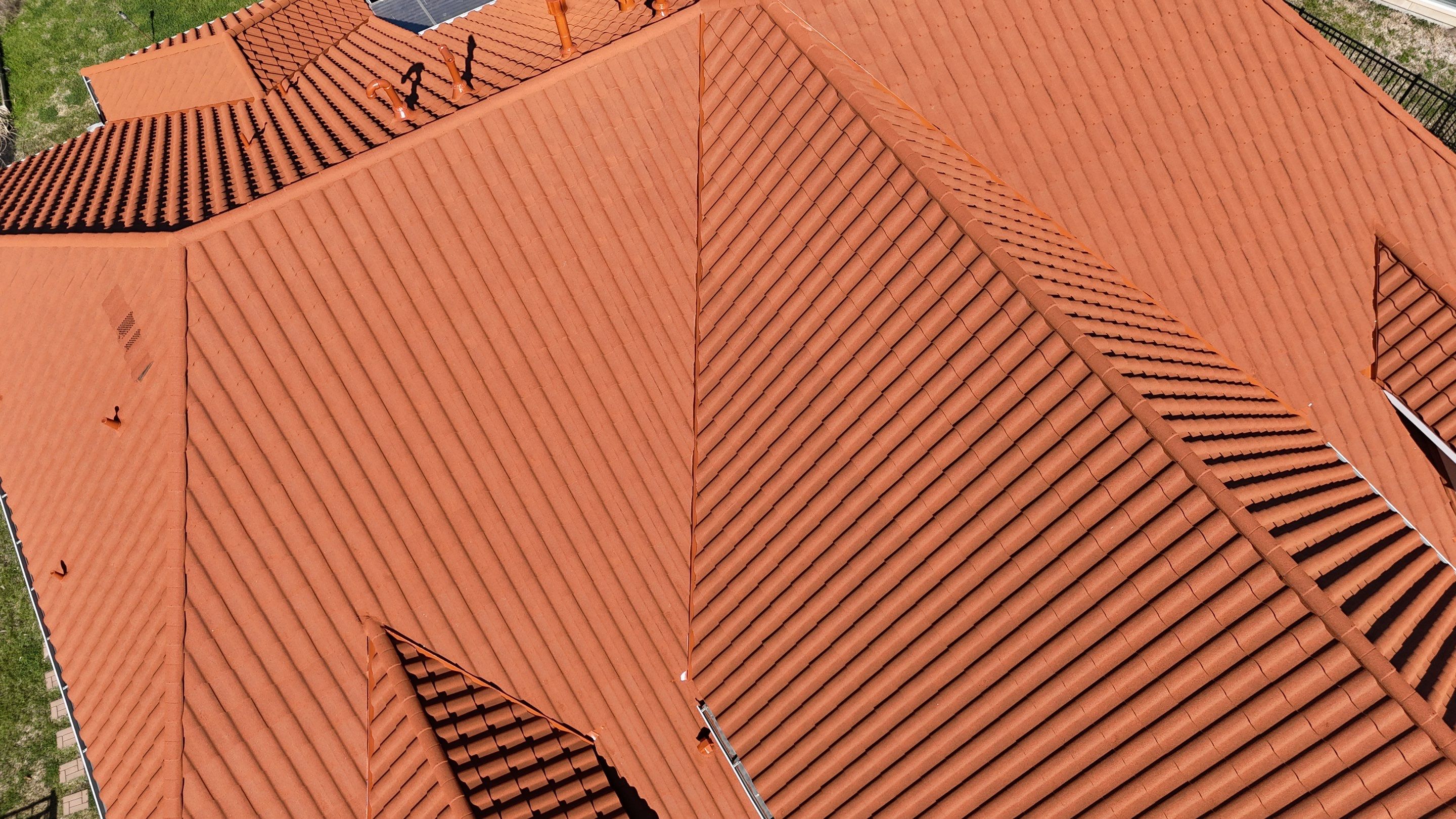 Stunning transformation using DECRA Villa Tile!  by Core Four Roofing