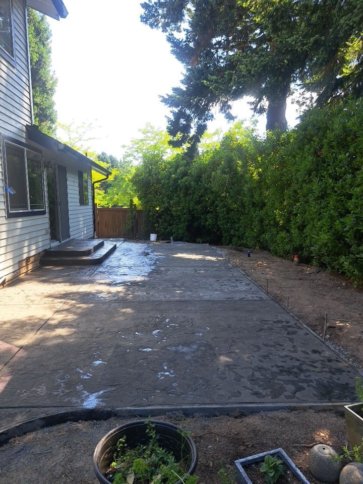 Luo | Colored Stamped Concrete Patio by Jireh Asphalt & Concrete Inc 