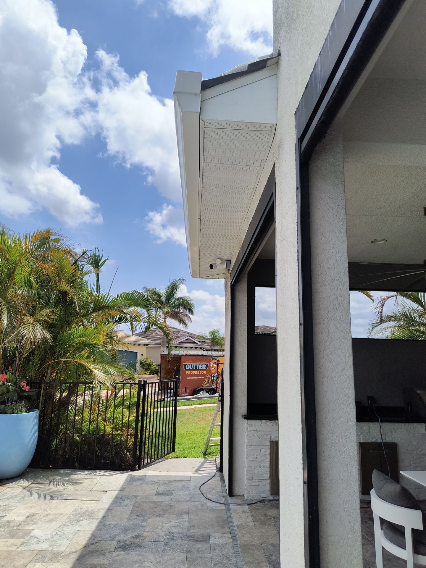 White Seamless Gutters with Downspouts in Bradenton FL by Gutter Professors