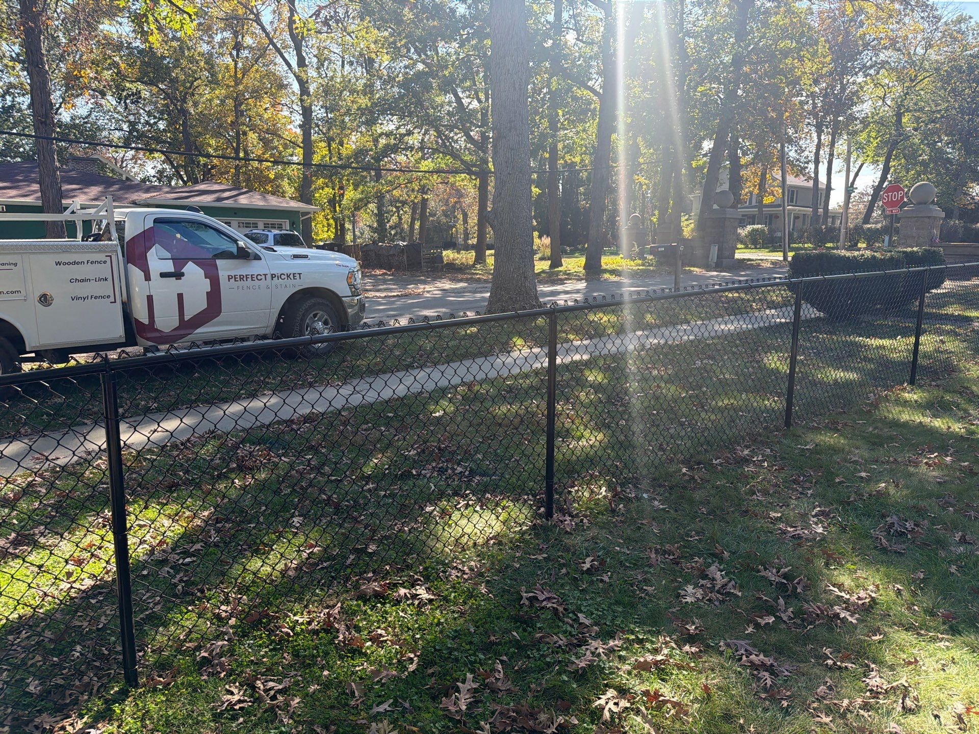 Residential Black Chain Link Fencing in Cedar Falls by Perfect Picket Fence and Stain