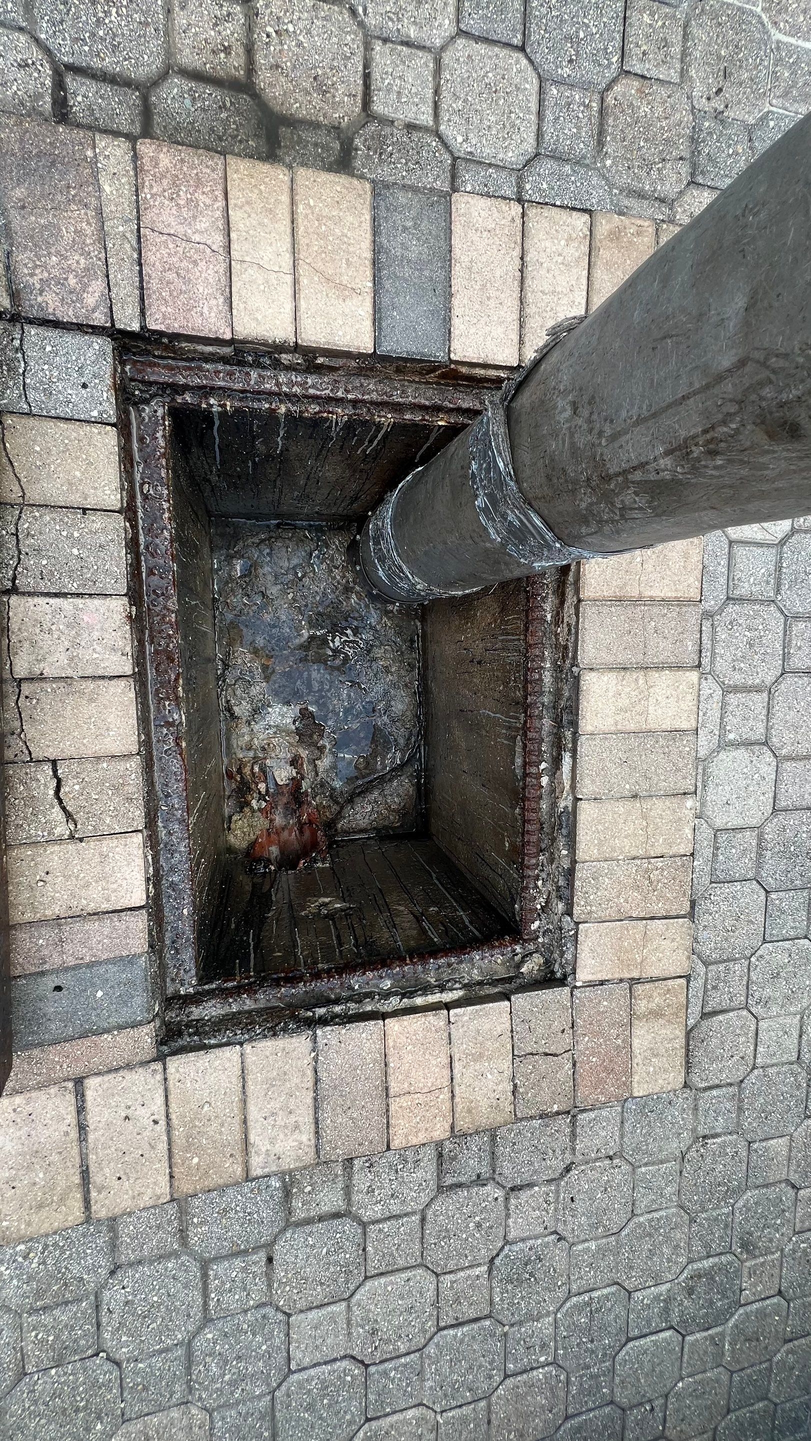 Catch Basin Cleaning After Hurricane Milton Naples Condo by APS Power & Water