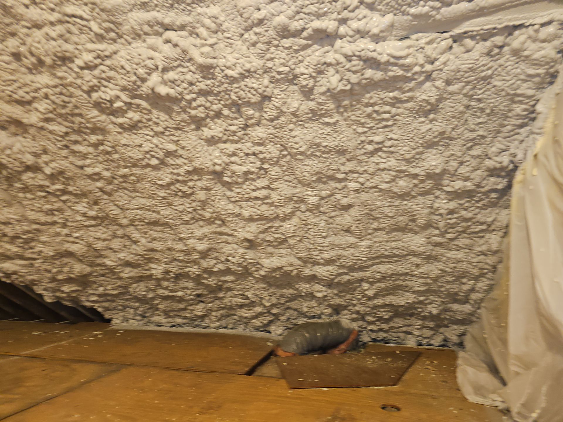 Attic Retrofit using open cell spray foam by NYS Foam & Energy