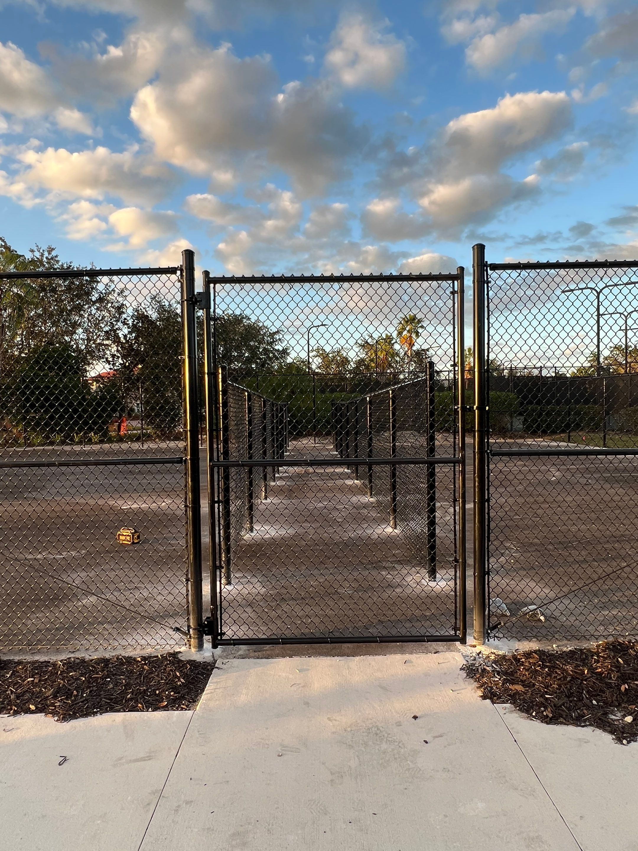 Chain-link Fence Installation using 8Ft Tall Black Chainlink Fence by Asap fence and gates, LLC