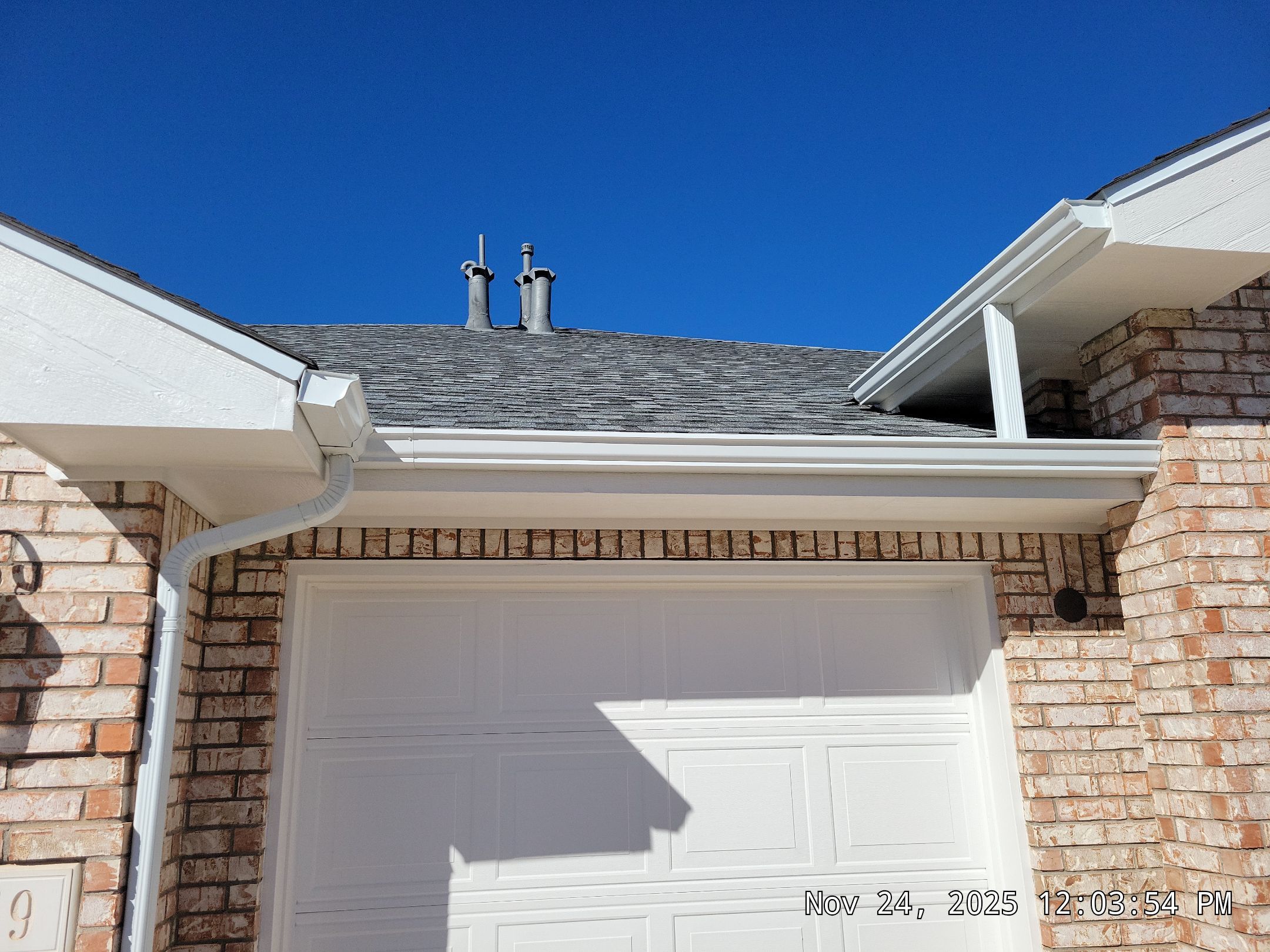 Seamless White Gutter and Downspout Installation in Albuquerque by Doyle Roof Masters Inc