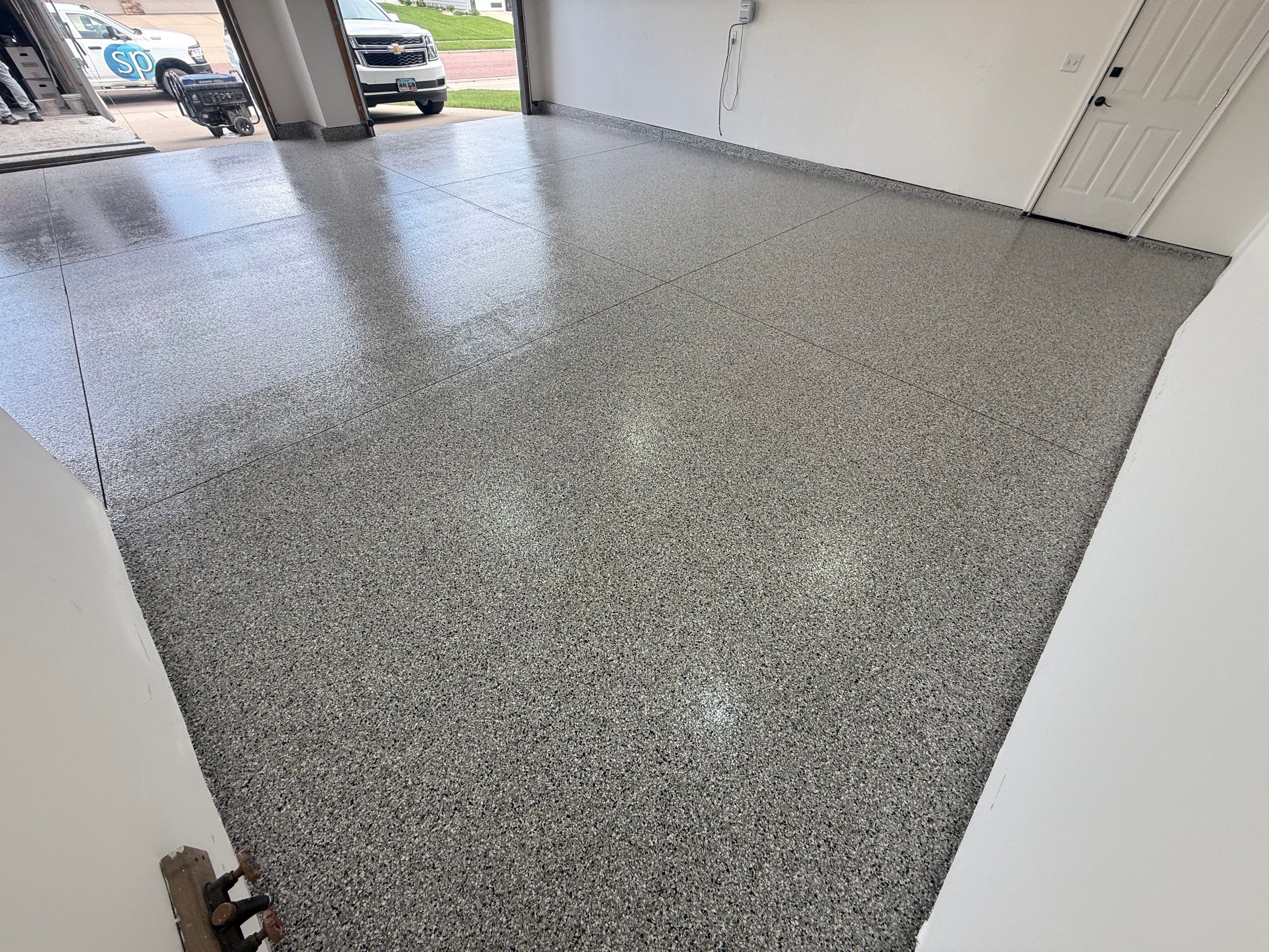 Full Garage Floor Resurfacing and Decorative Epoxy Flake Finish by Select Painting, Coatings & Garage Cabinets