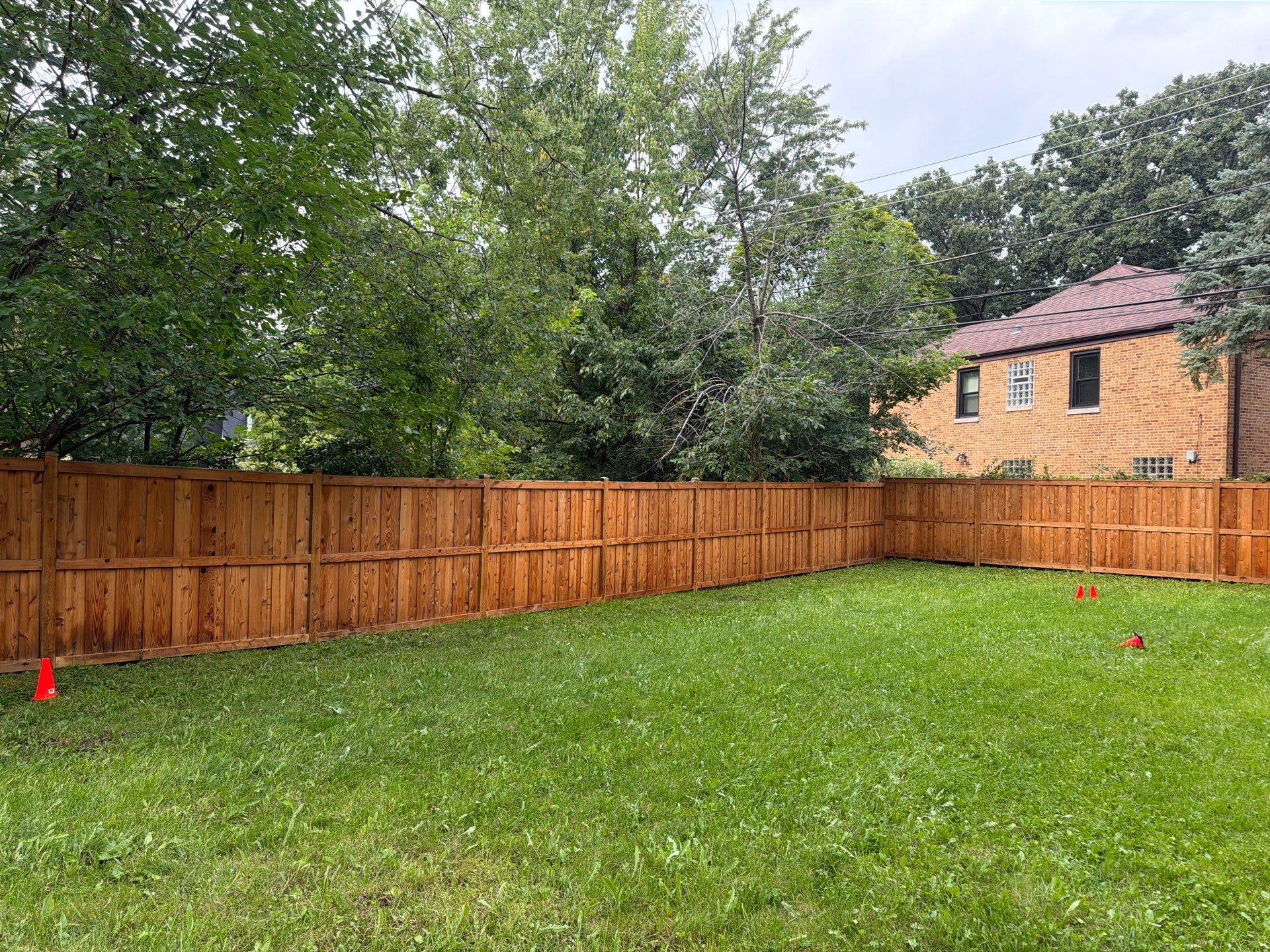Wood fence cleaning and sealing by Northern Power Washing LLC.