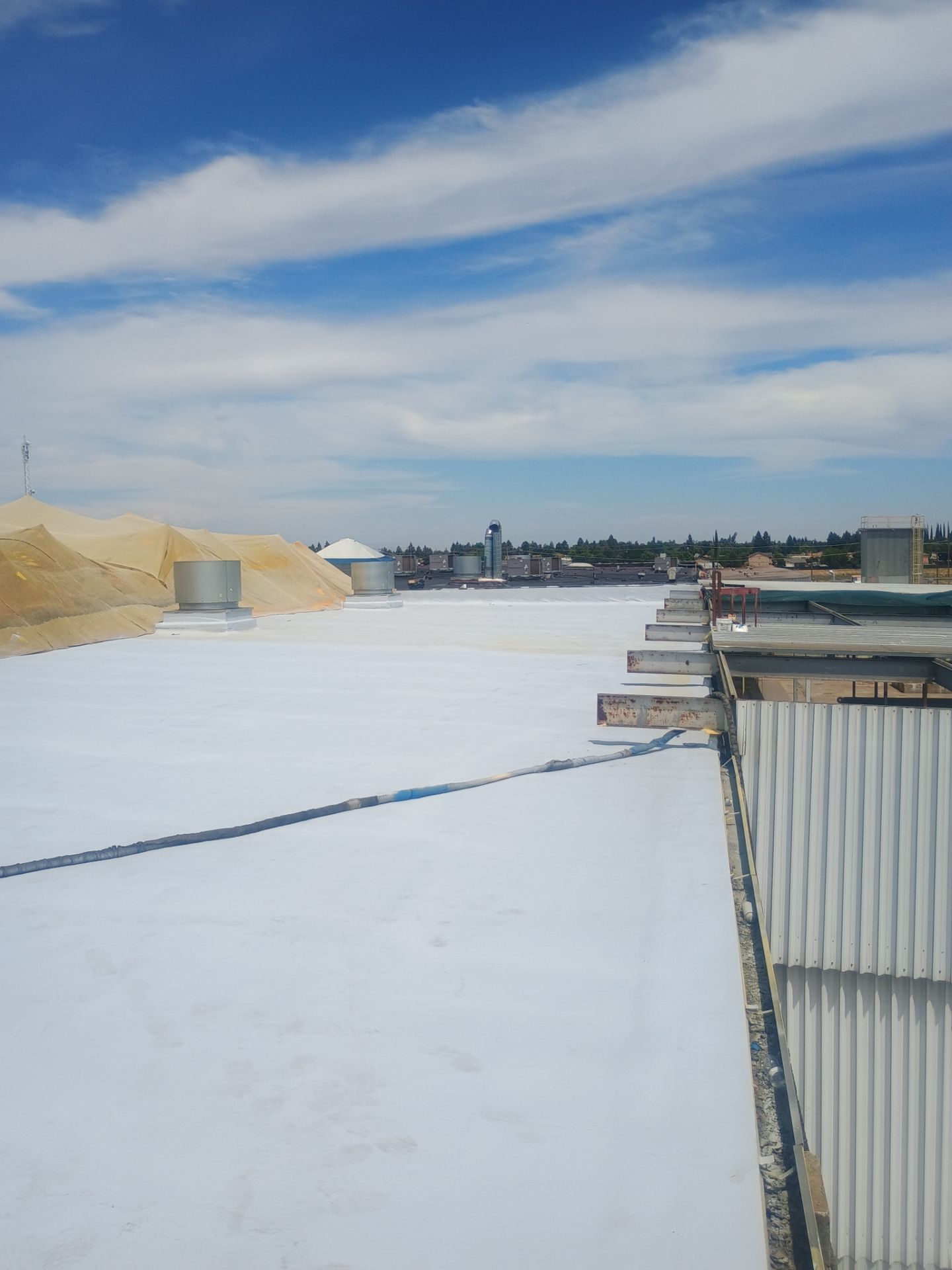 Pro Farms Spray foam roofing project by Straight Edge Roofing Inc