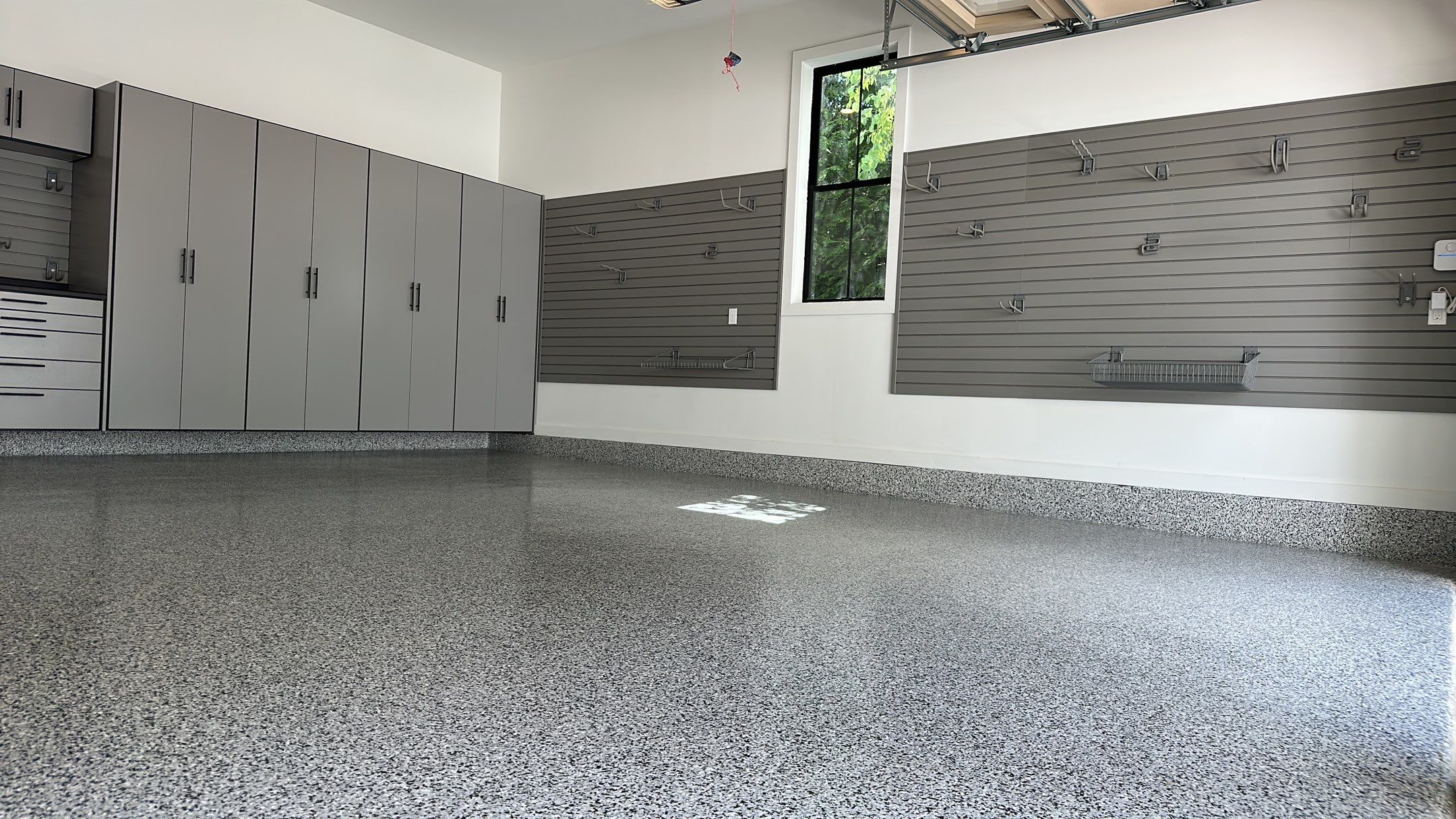 Jeanne E. transformed her garage with cabinets and a Banner Garage Floor by Banner Garage