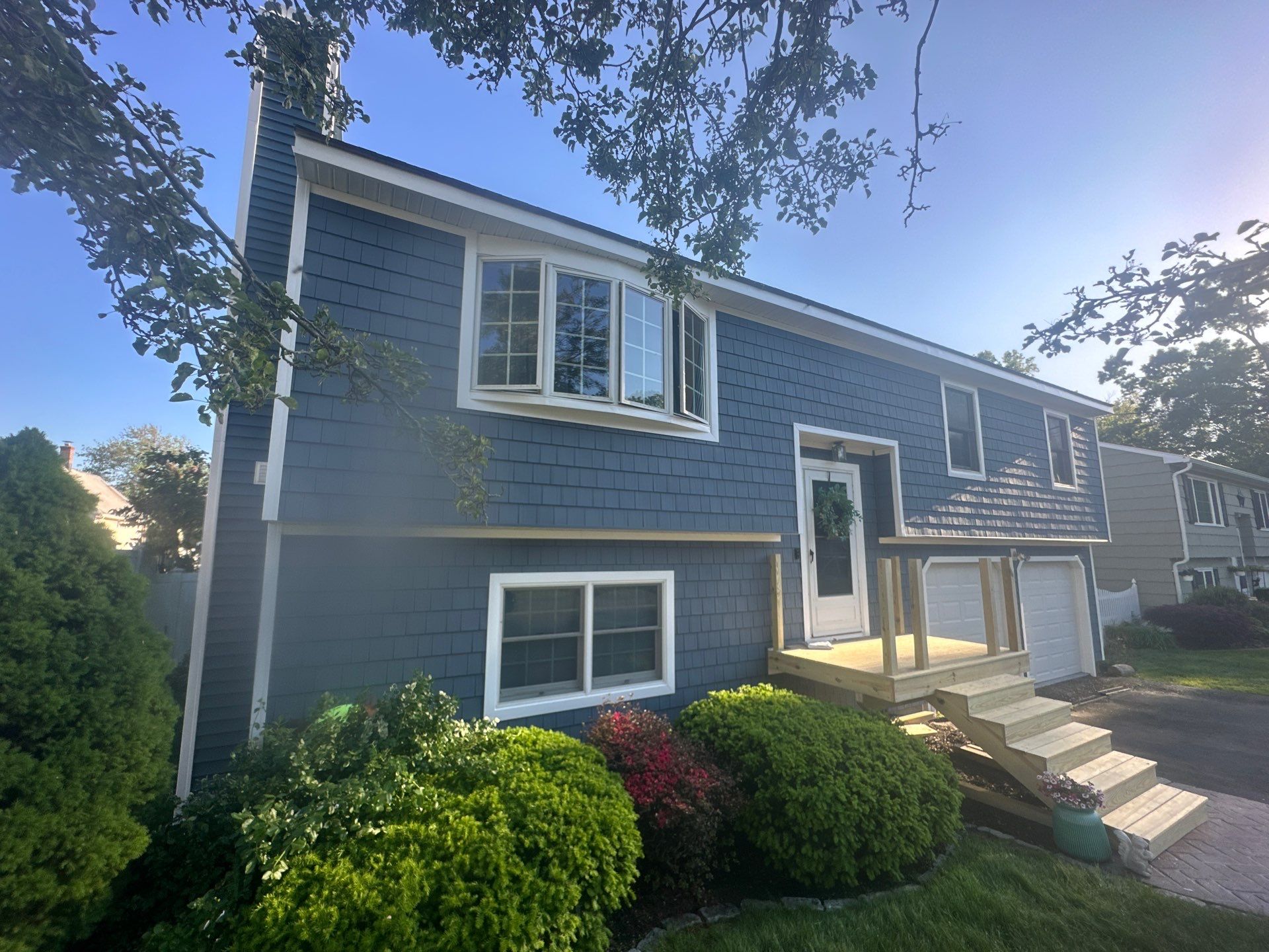 Siding Installation using Certainteed Cedar Impressions Straight Edge Perfection Shingles - D7 - Pacific Blue by A Plus Exterior