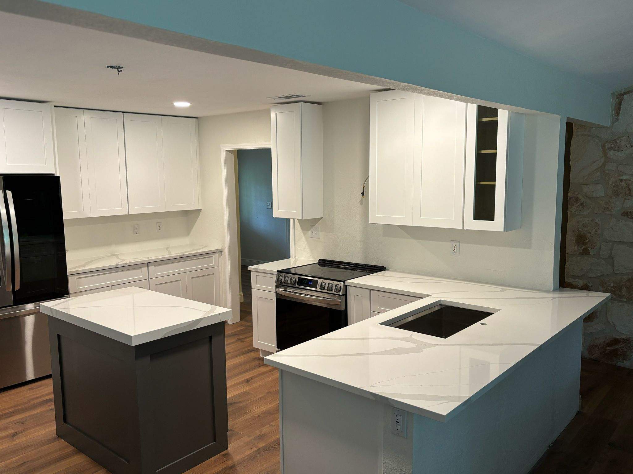 Modern Kitchen Renovation with White Shaker Cabinets in San Antonio by Mena stone surfaces