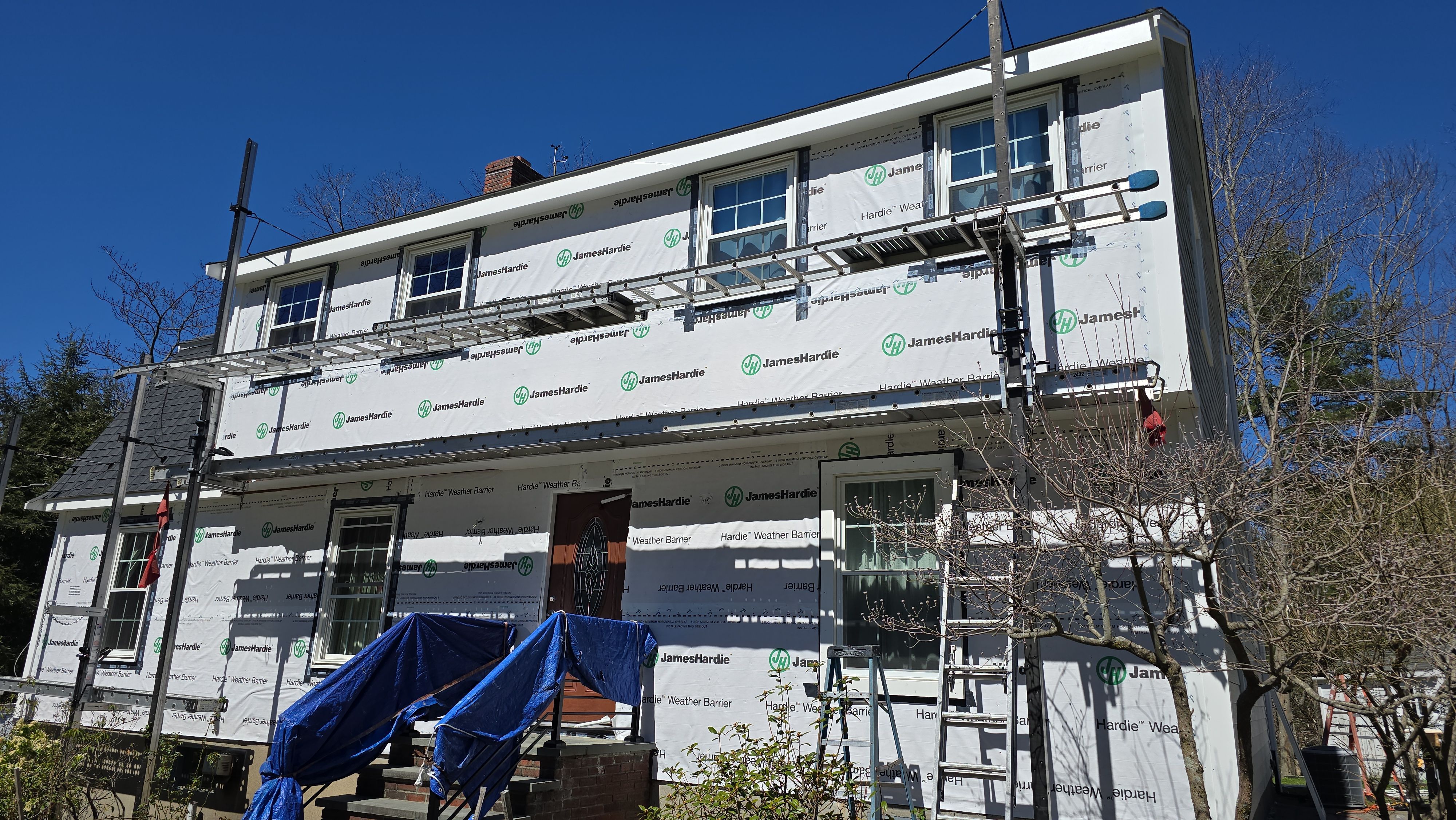 Custom window trim work and siding replacement in Dover, MA by UBrothers Construction