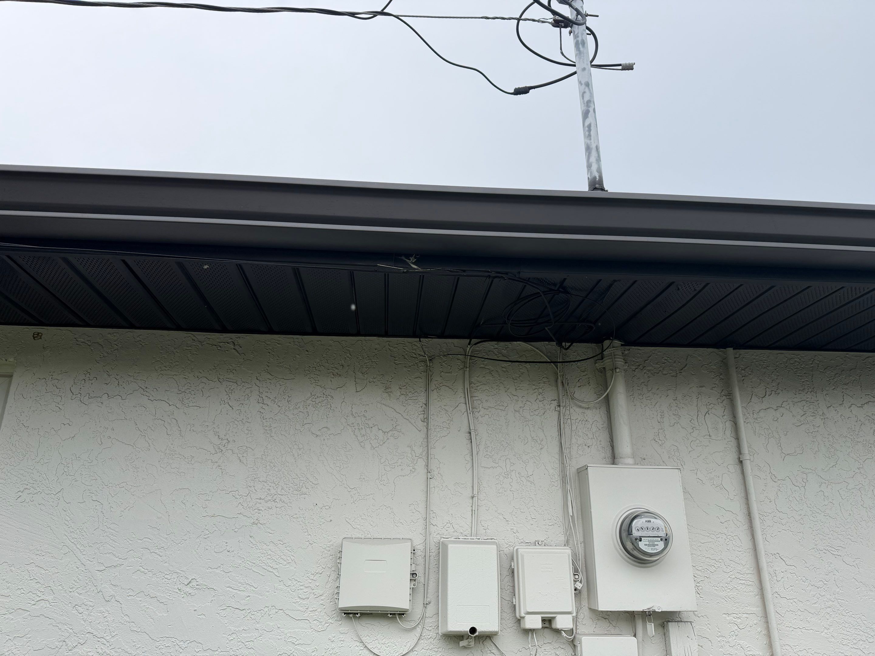 Black Seamless Gutters for a Modern Look in Cape Coral FL by Gutter Professors