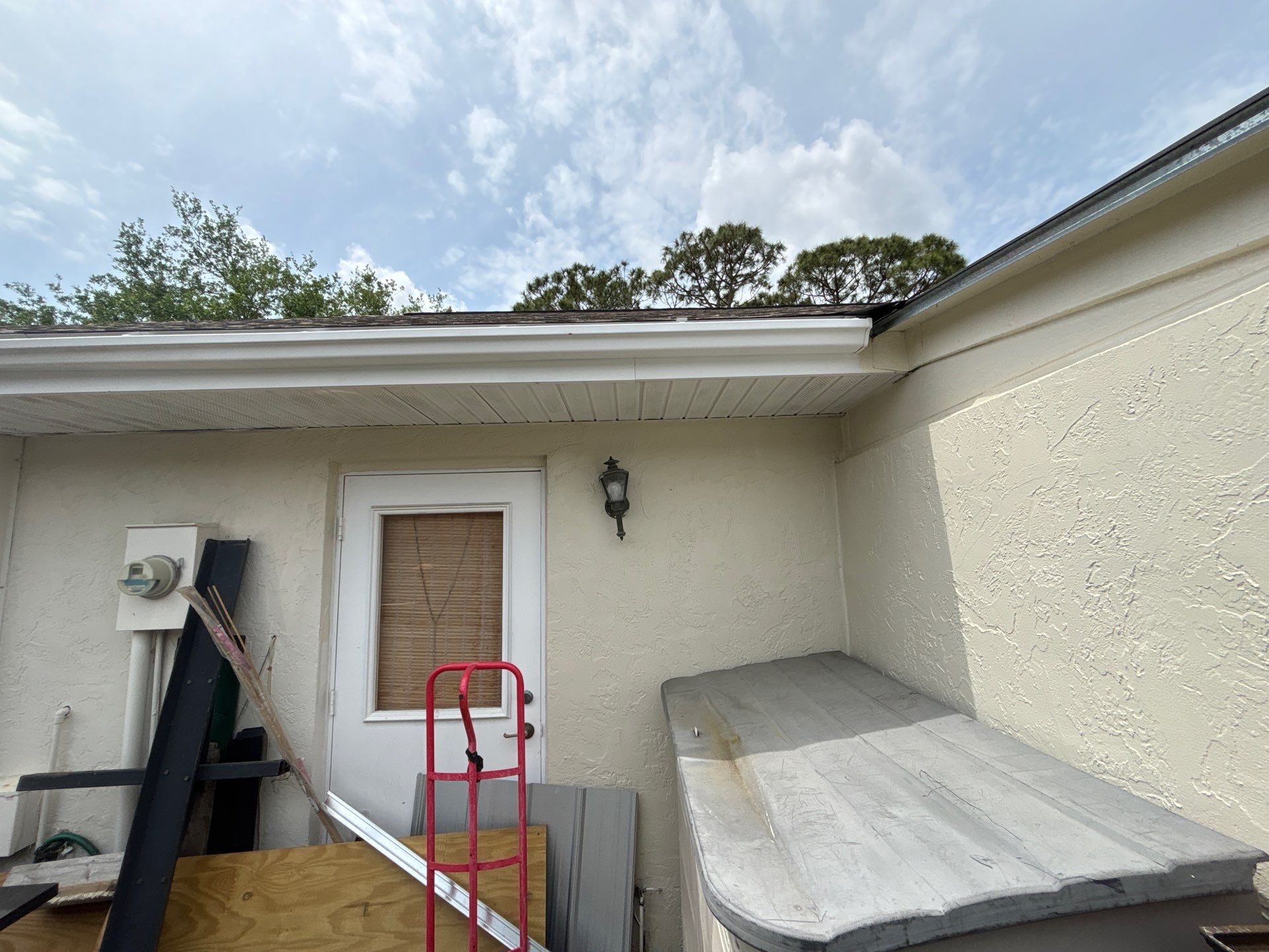 Gutter Project with White 6-K Seamless Gutters Installation and Downspouts in Sarasota FL by Gutter Professors