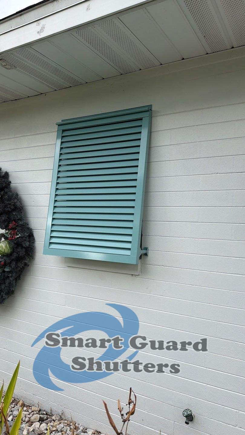 Hurricane Fabric in White / Decorative Bahama in Pastel Turquoise by Smart Guard Shutters