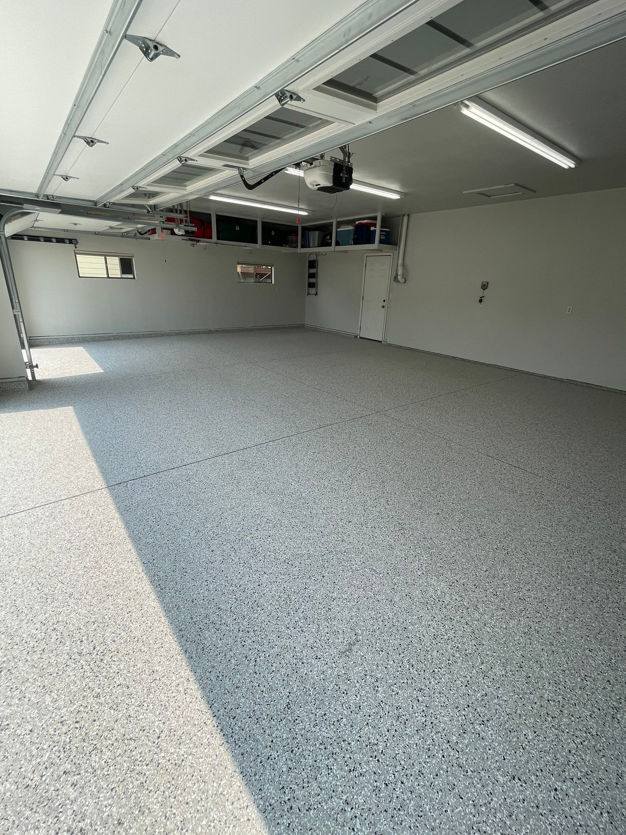 Multi-Car Garage Floor Coating and Crack Repair in Tea by Select Painting, Coatings & Garage Cabinets