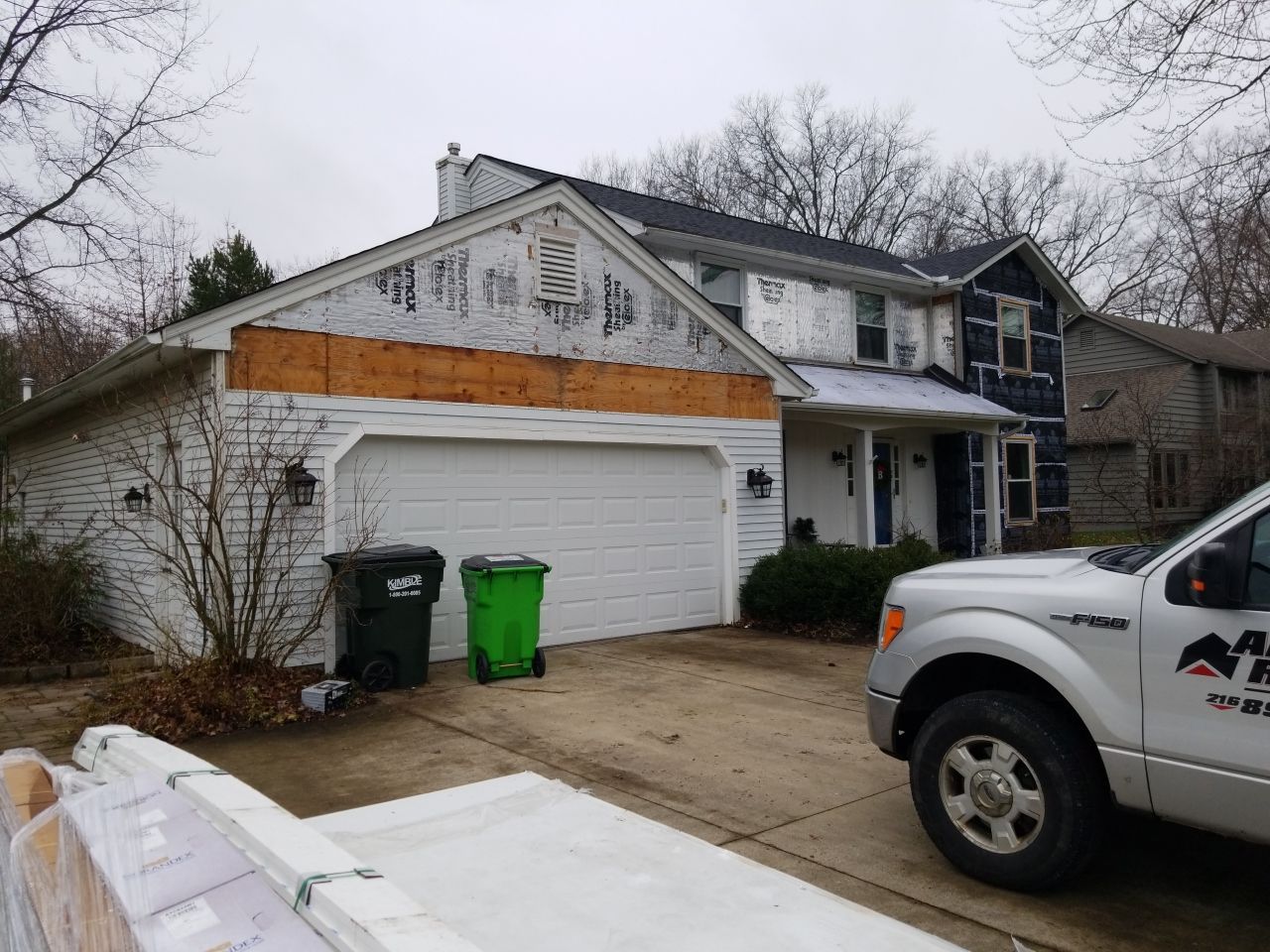 James Hardie Siding  using James Hardie Board and Batten, White by Absolute Roofing and Construction