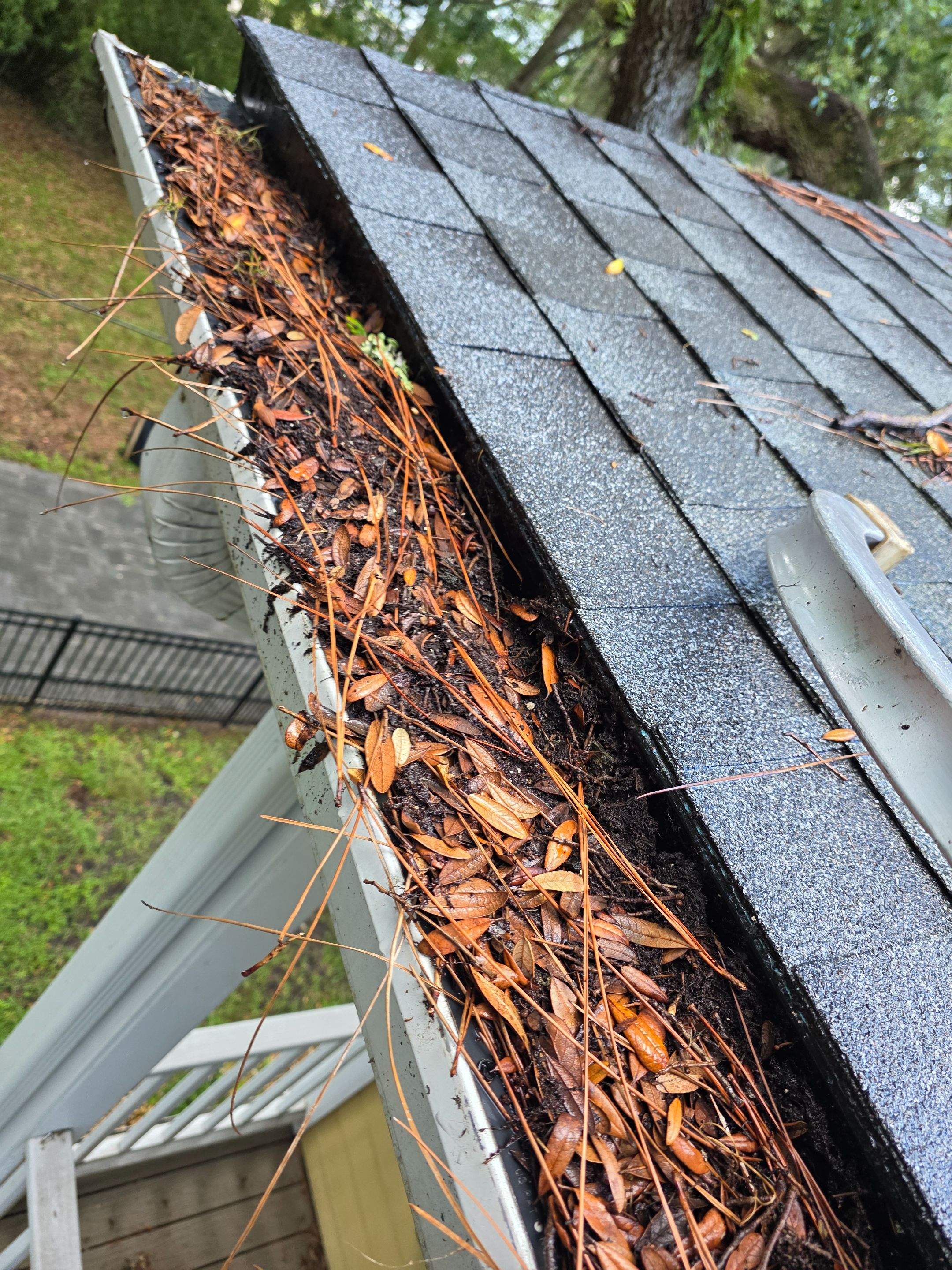 Commercial gutter cleaning Yulee, FL before photo with filled gutters