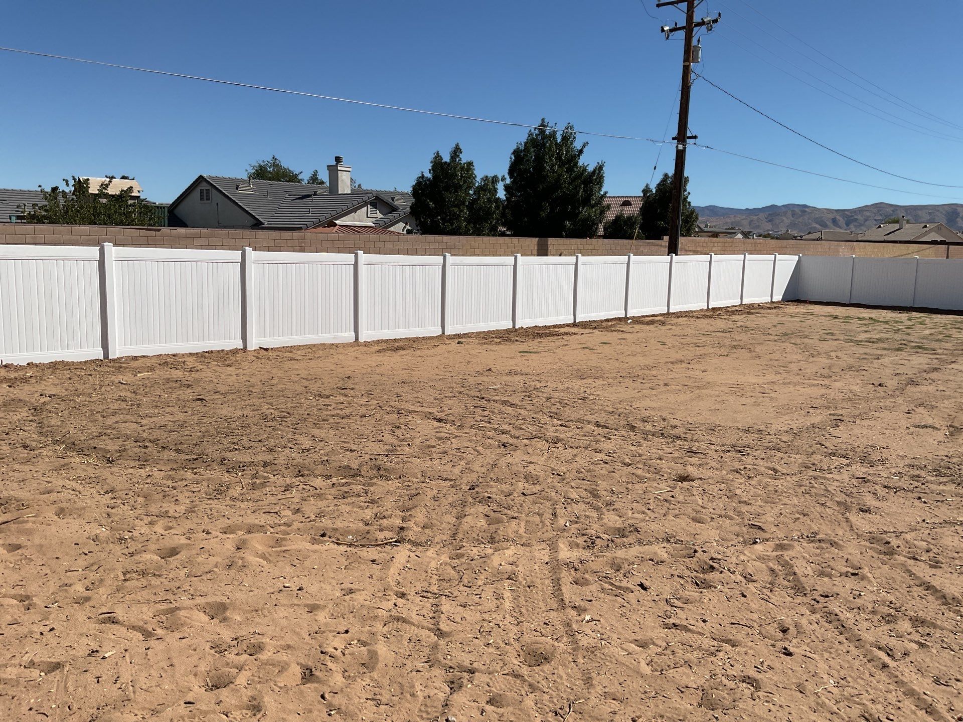 White picket fence  by Fence Guys Inc. 