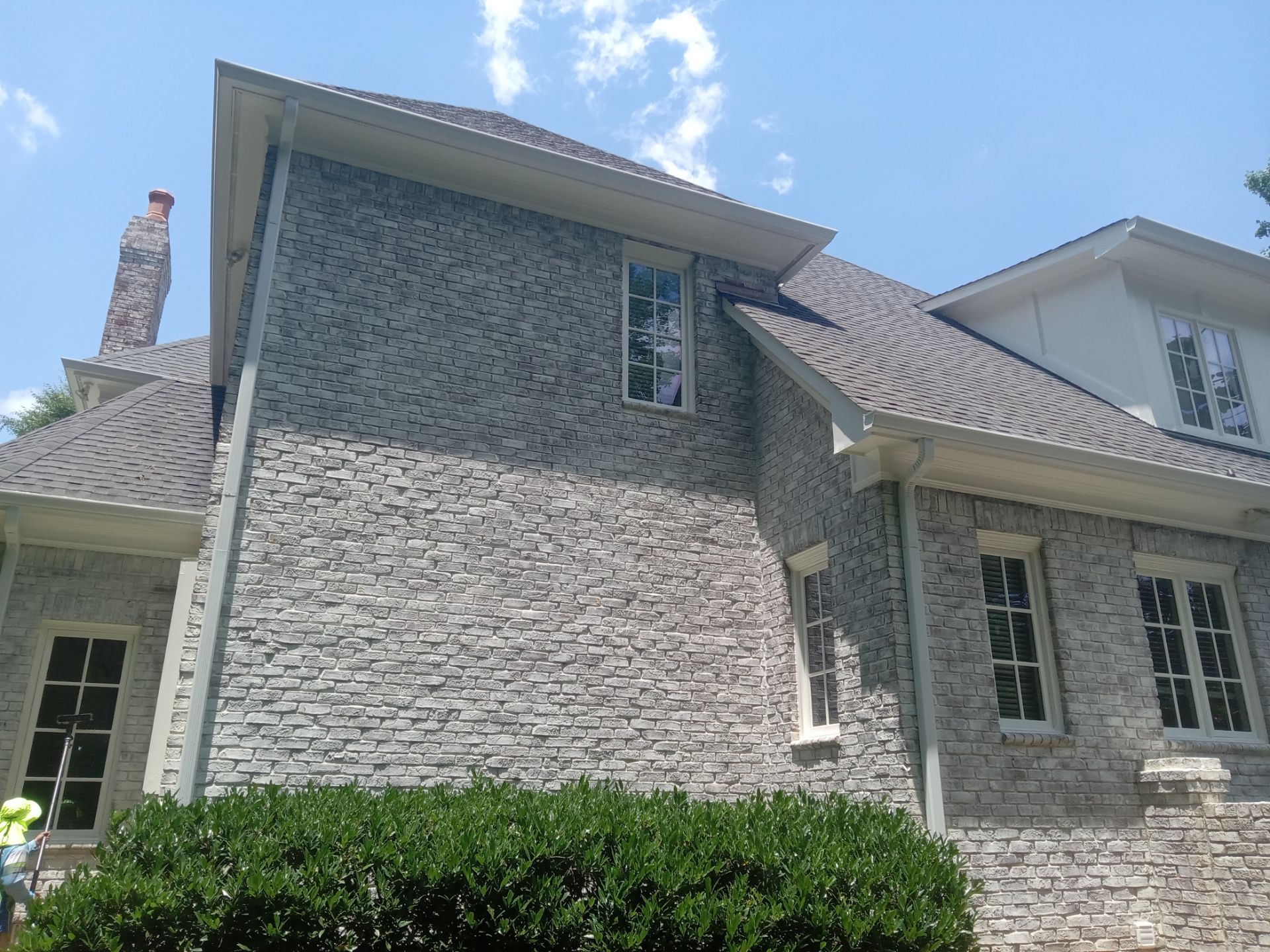 pressure washing exterior brick and siding cleaning dirt and grime buildup from house surfaces restoring curb appeal