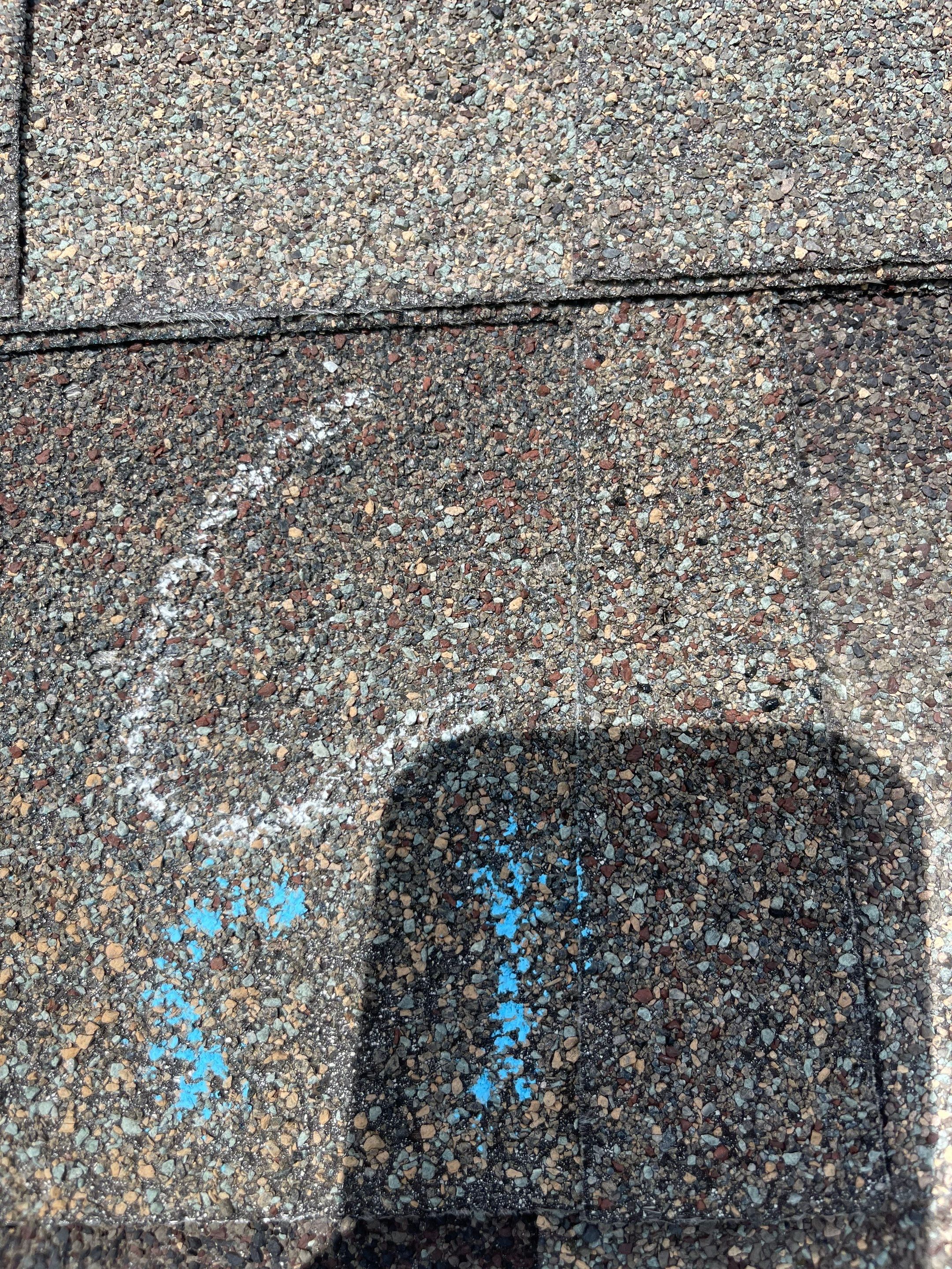 Hail Damage on a Roofing System by Icon Roofing And Construction 