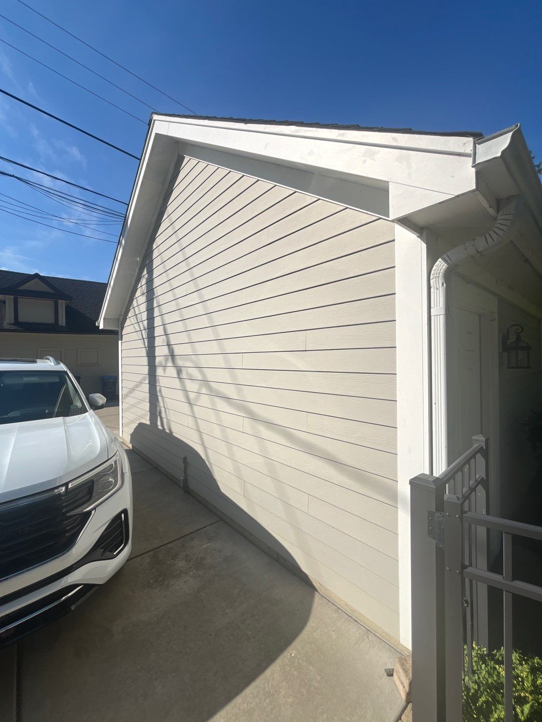 Hardie Board House & Detached Garage Soft Washing by Northern Power Washing LLC.