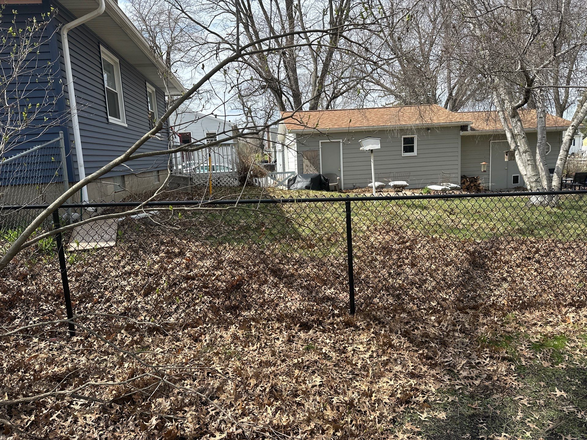 Black Vinyl-Coated Chain Link Fence Installation in Cedar Falls by Perfect Picket Fence and Stain