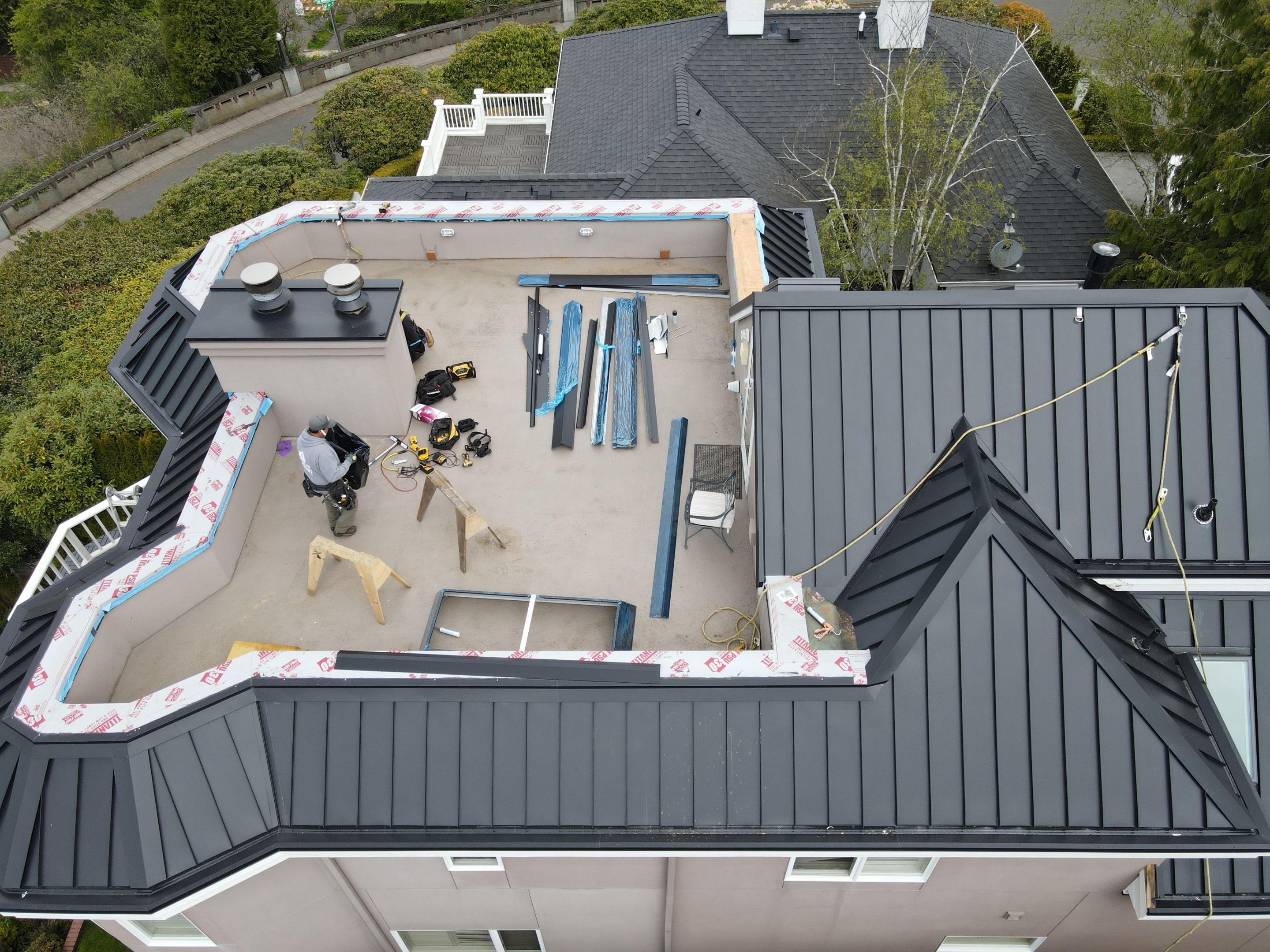 Seattle Queen Anne Rooftop Deck and Roof Replacement using Standing Seam Metal - Black by RoofSmart