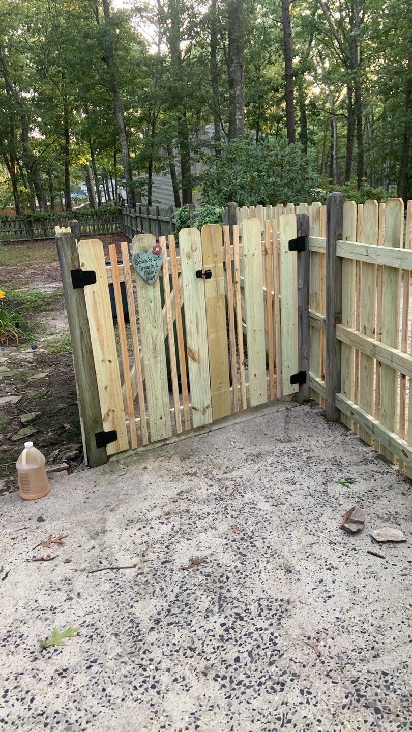 Custom Fence Built using Treated Lumber by A1 NERDY HOMES LLC