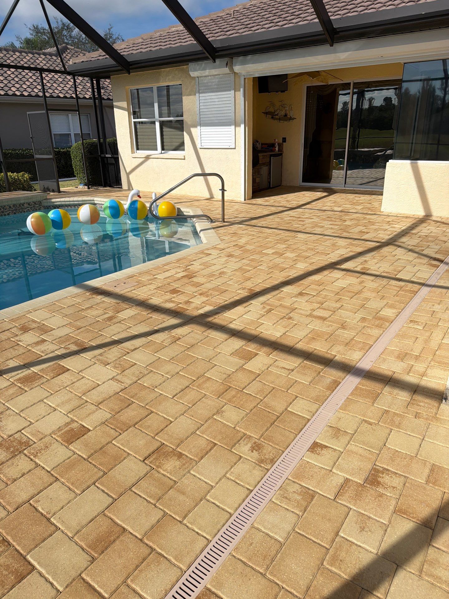 Custom Tan Paver Pool Deck and Patio in Sun City Center by Supreme Paver Experts