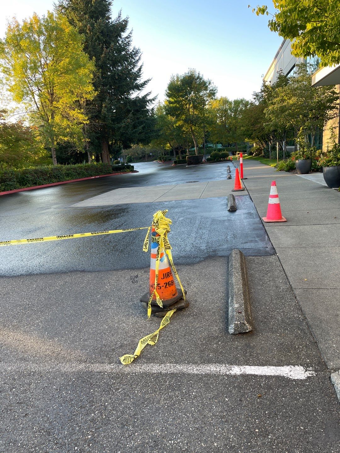 Kidder Matthews | Parking Lot Sealcoating & Striping with Concrete Curb & Patch Repairs  by Jireh Asphalt & Concrete Inc 