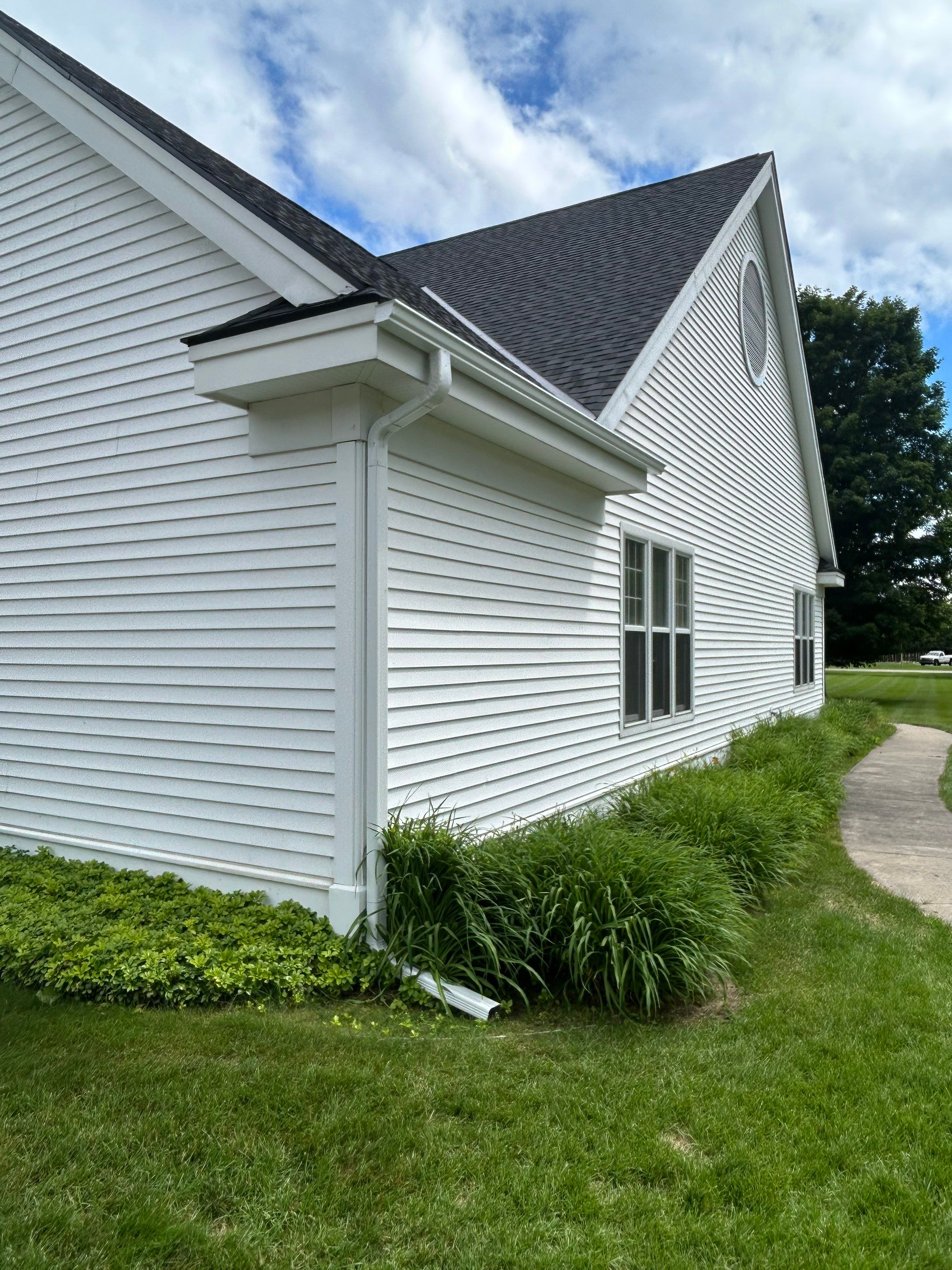Gutter and Gutter Screen Installation for Harbor Springs Church by Rainbow Seamless Systems