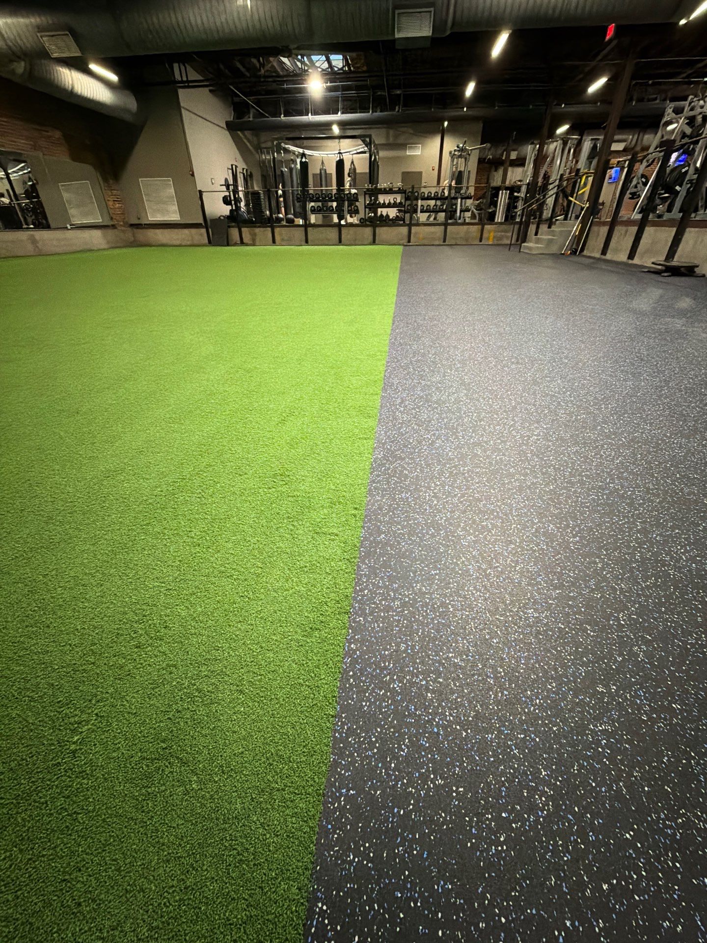 Norfolk OLF - Strength area turf, rubber installation and front desk by Nova HomeWorks 