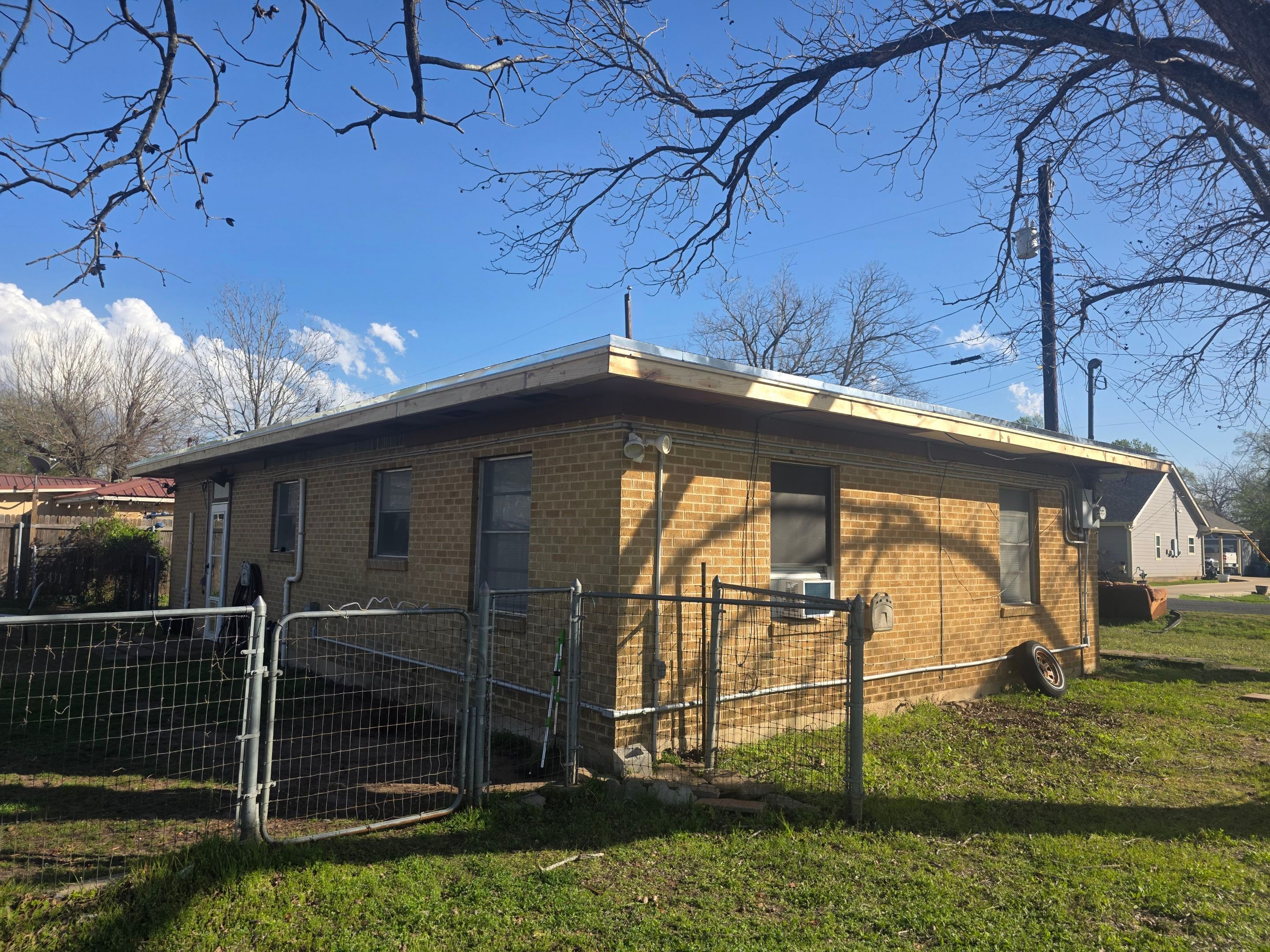 Torch down modified bitumen roof and full fascia "face-lift" in Elgin, TX by REPS Austin Area Roofer