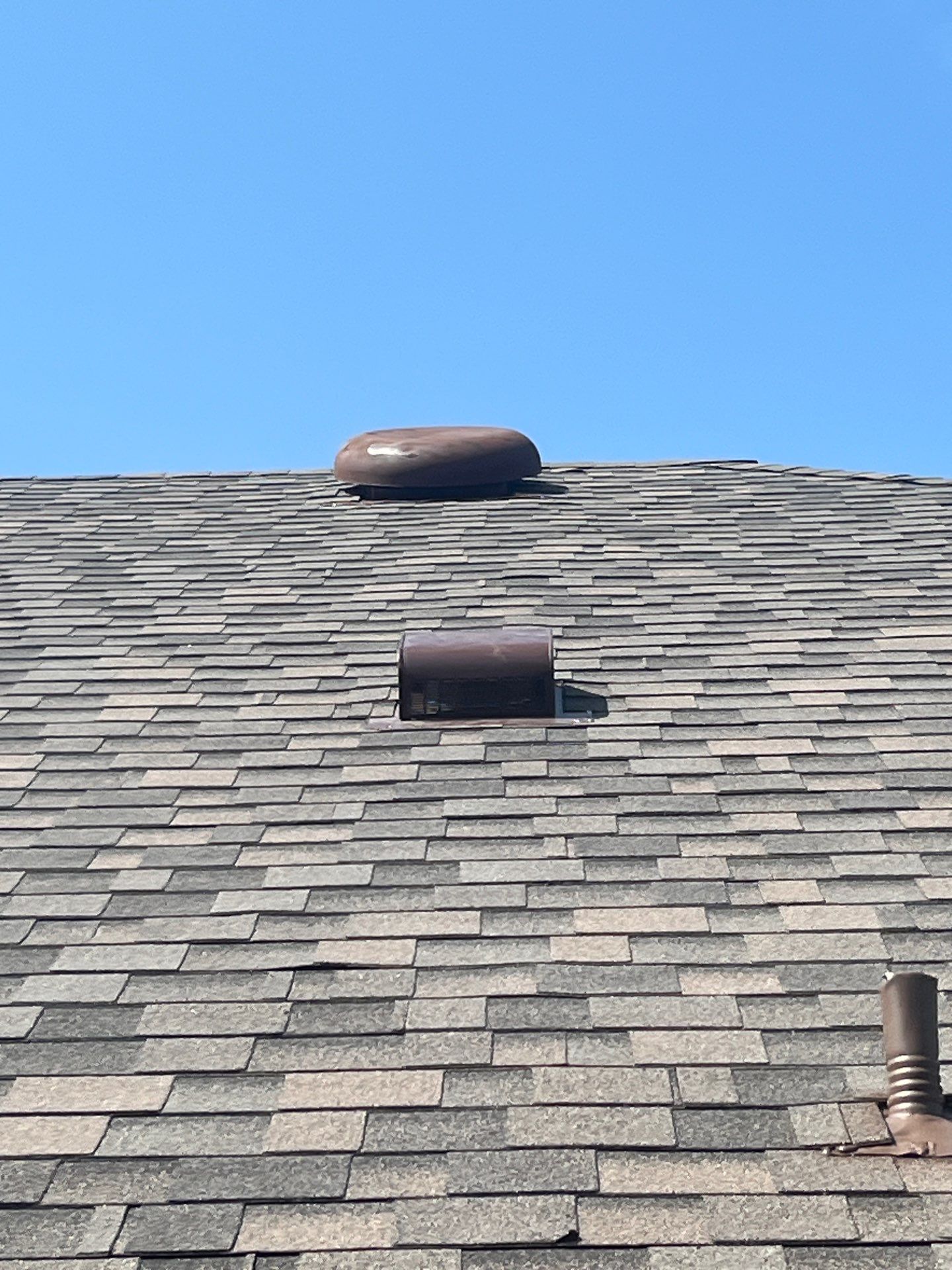 Medium brown brick with IKO Driftshake by Tejas Roofworks + Restoration