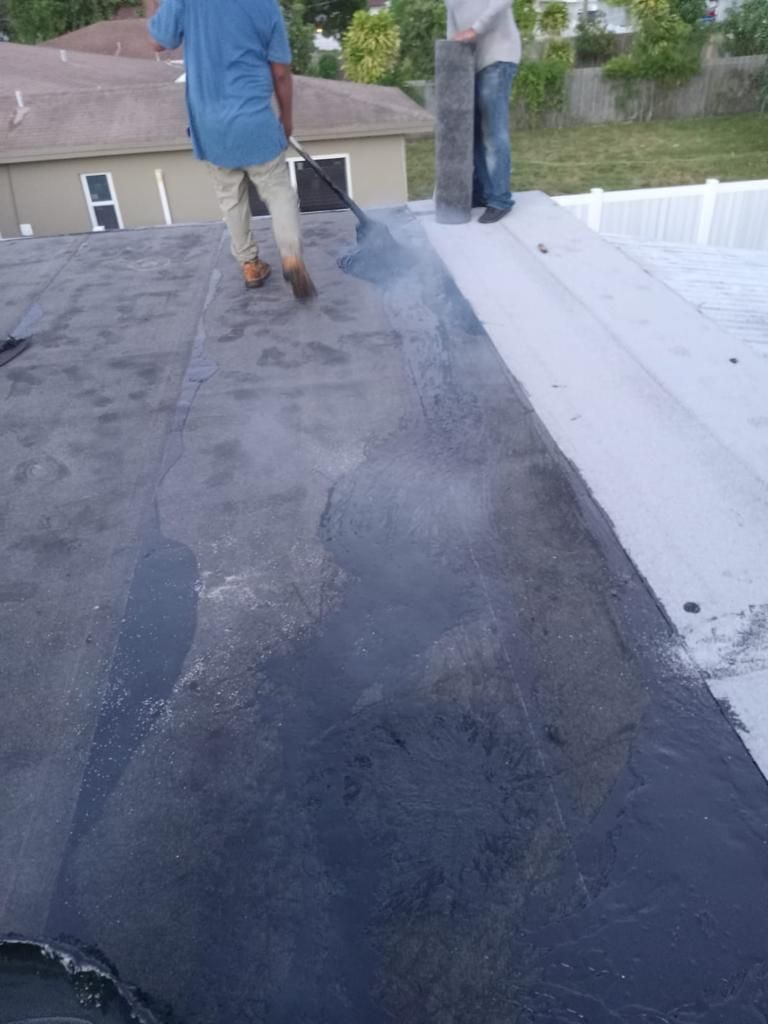 Standing Seam Metal & Flat Re-Roof using 1.5" Nail Strip 24ga Black Matte Kynar Coated Standing Seam Metal Panels by Morton Roofing, Inc.