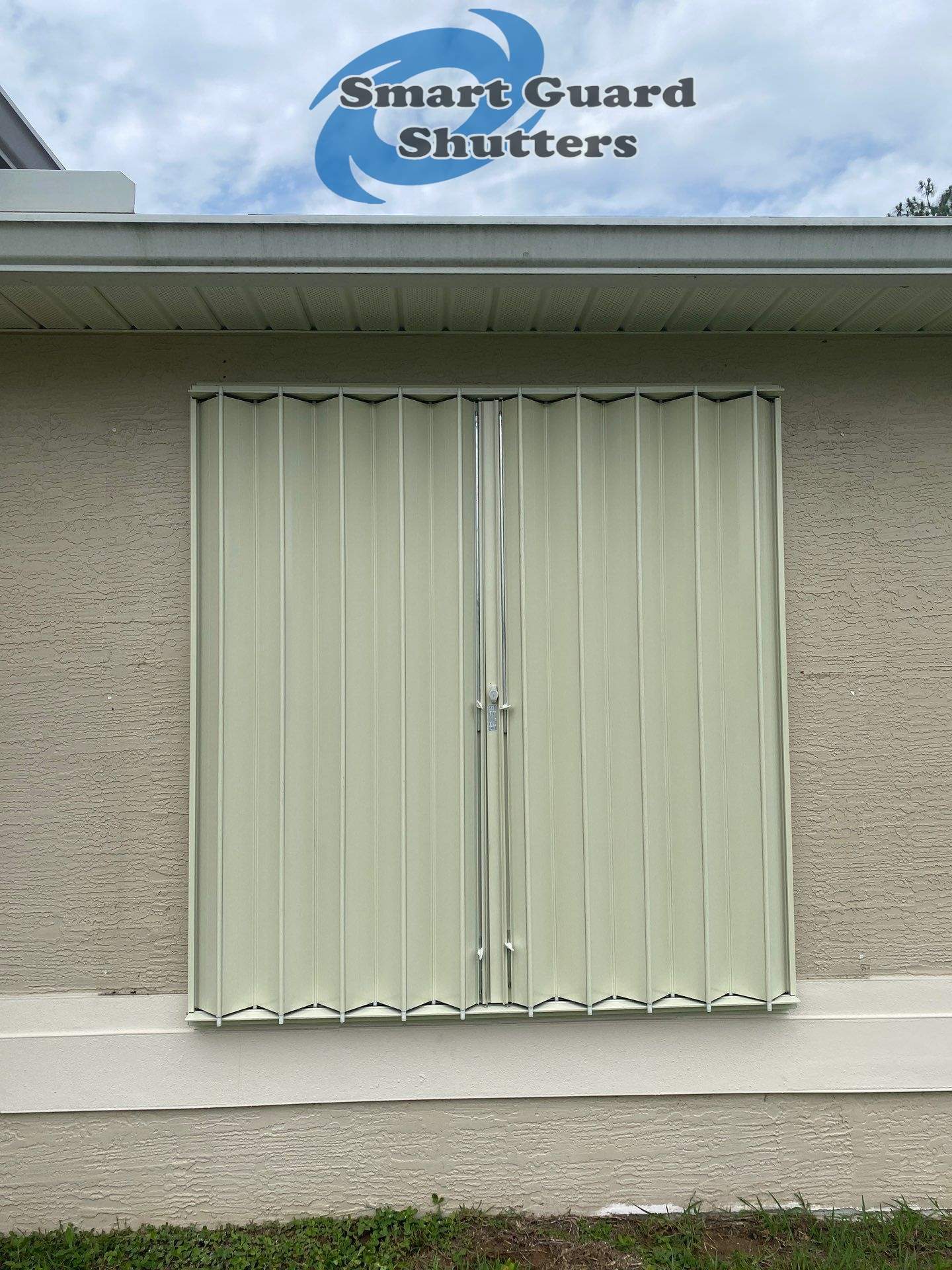 Accordion Shutters in Ivory  by Smart Guard Shutters