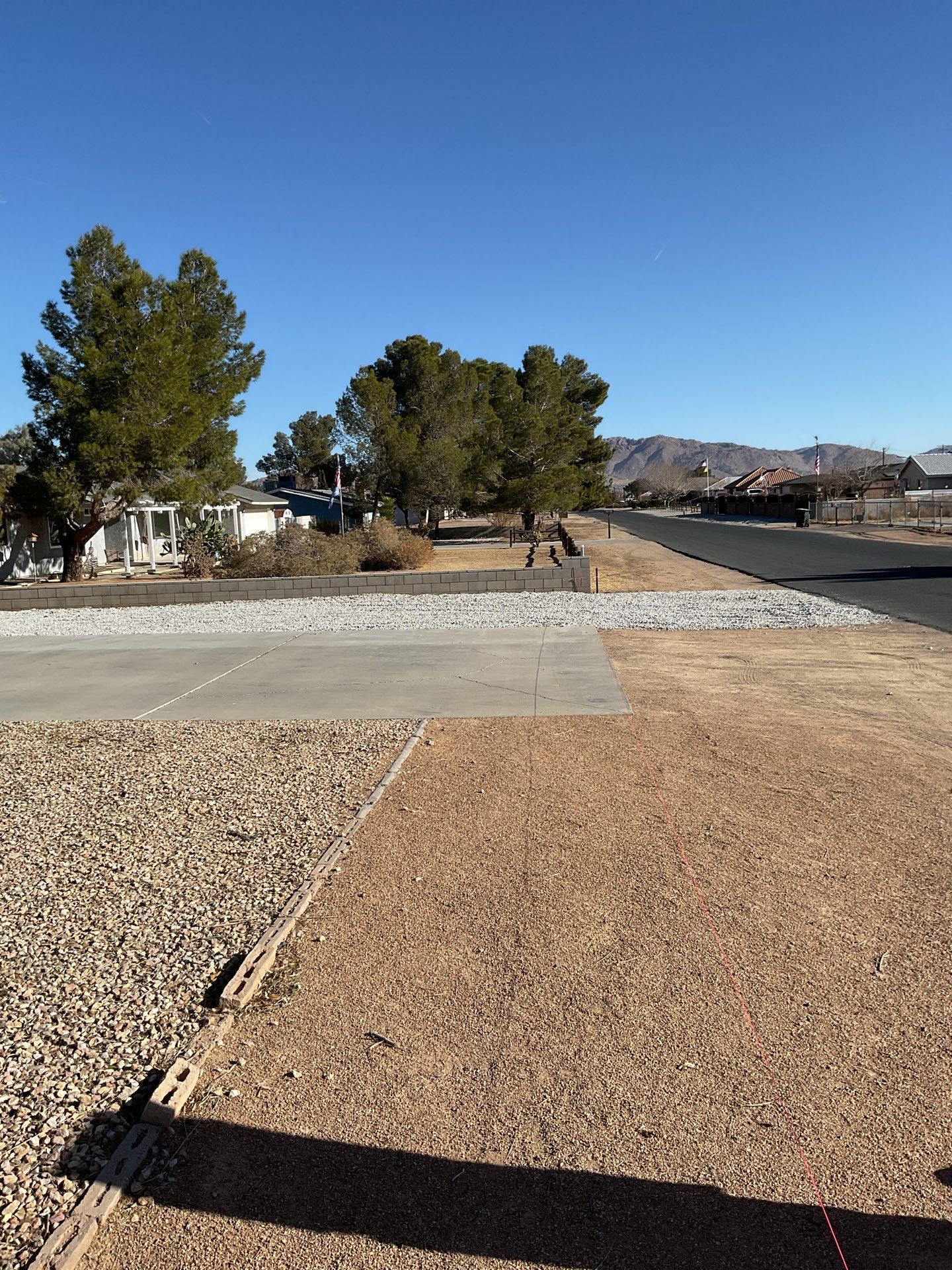 Sleek chain link fence installation with a solar motorized gate by Fence Guys Inc.