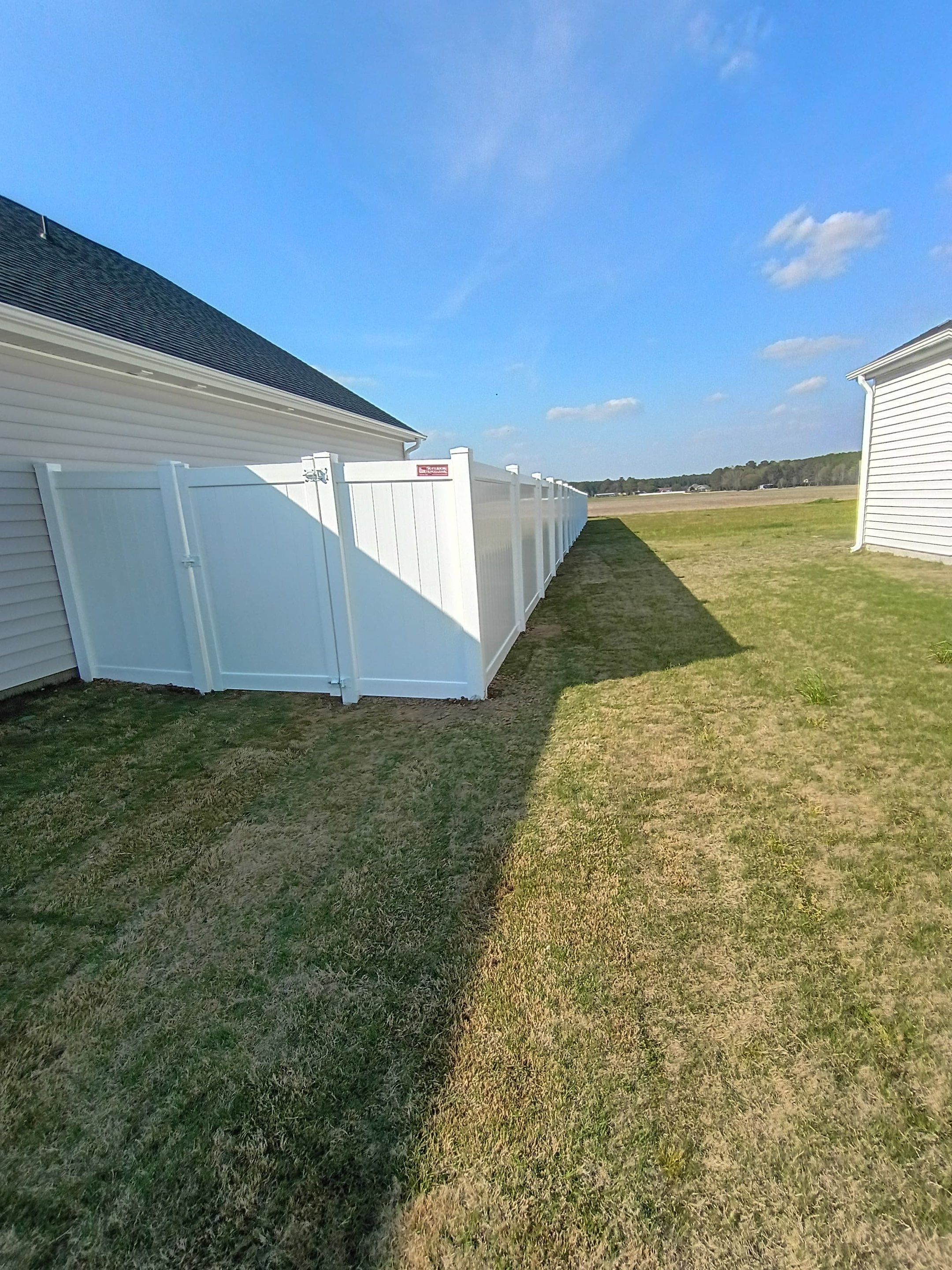 White Vinyl Privacy Fence Installation in Ayden, North Carolina by Superior Fence and Rail