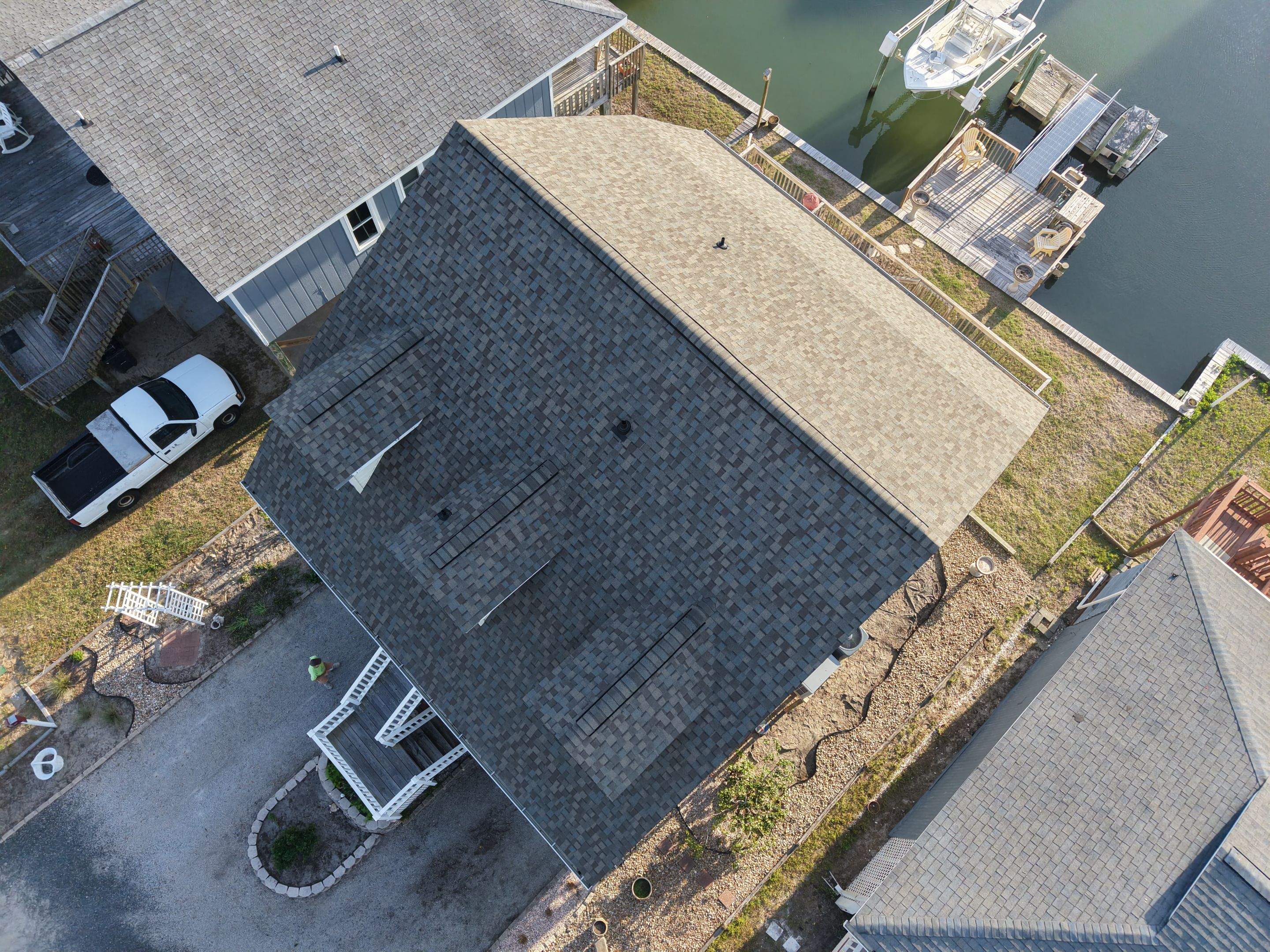 Holden Beach Canal-Side FORTIFIED Roof Replacement with Coastal Blue Shingles by RGR Construction and Roofing, LLC