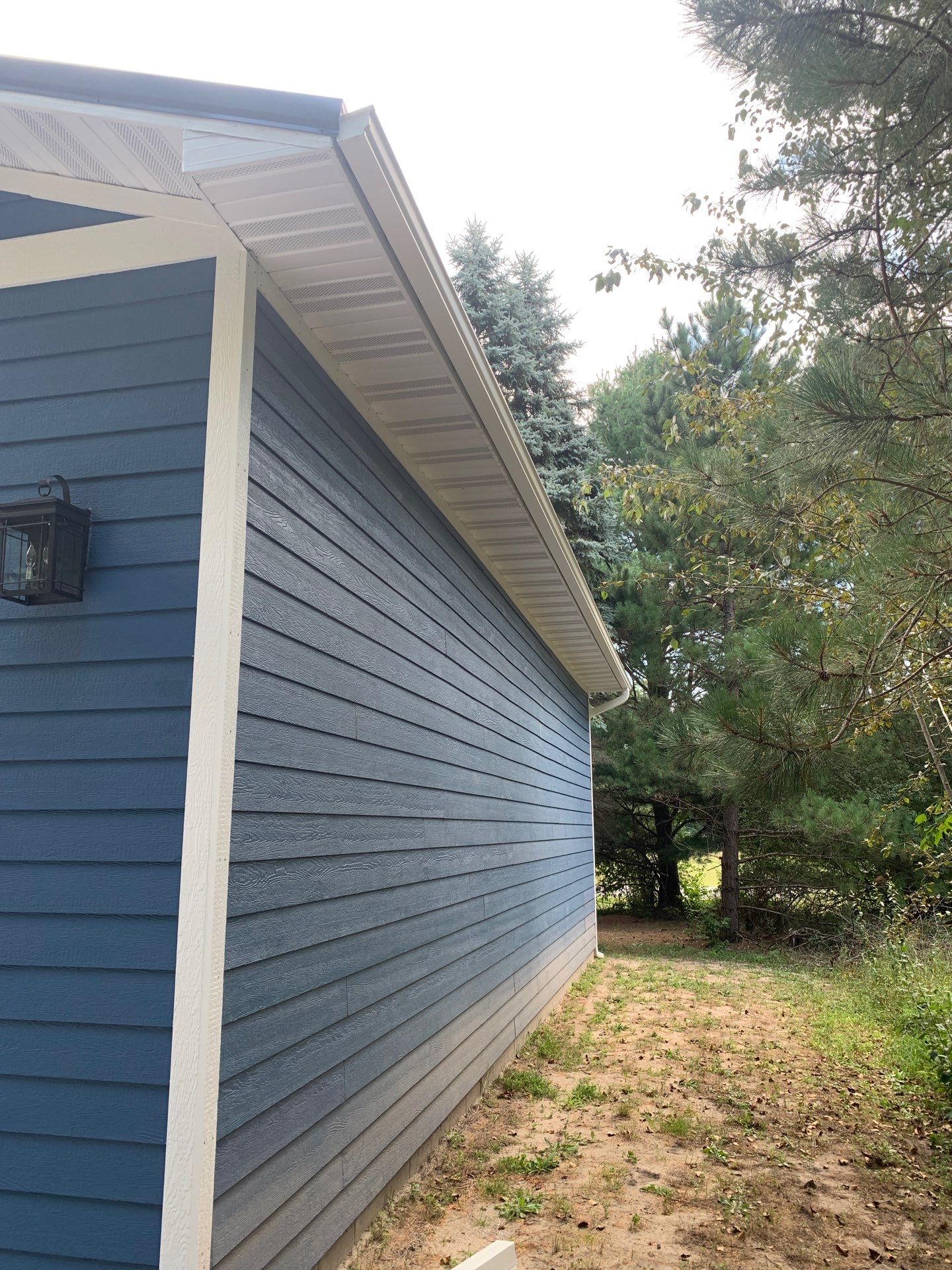 Gutter and Gutter Helmet Installation for Lake Leelanau Home by Rainbow Seamless Systems
