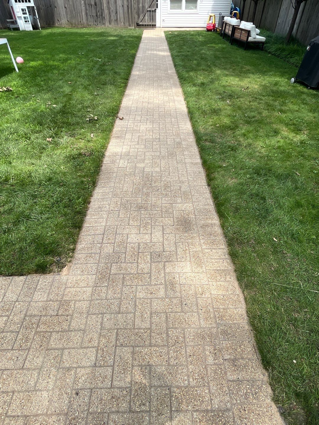 Brick patio repair, clean sand and seal by Northern Power Washing LLC.
