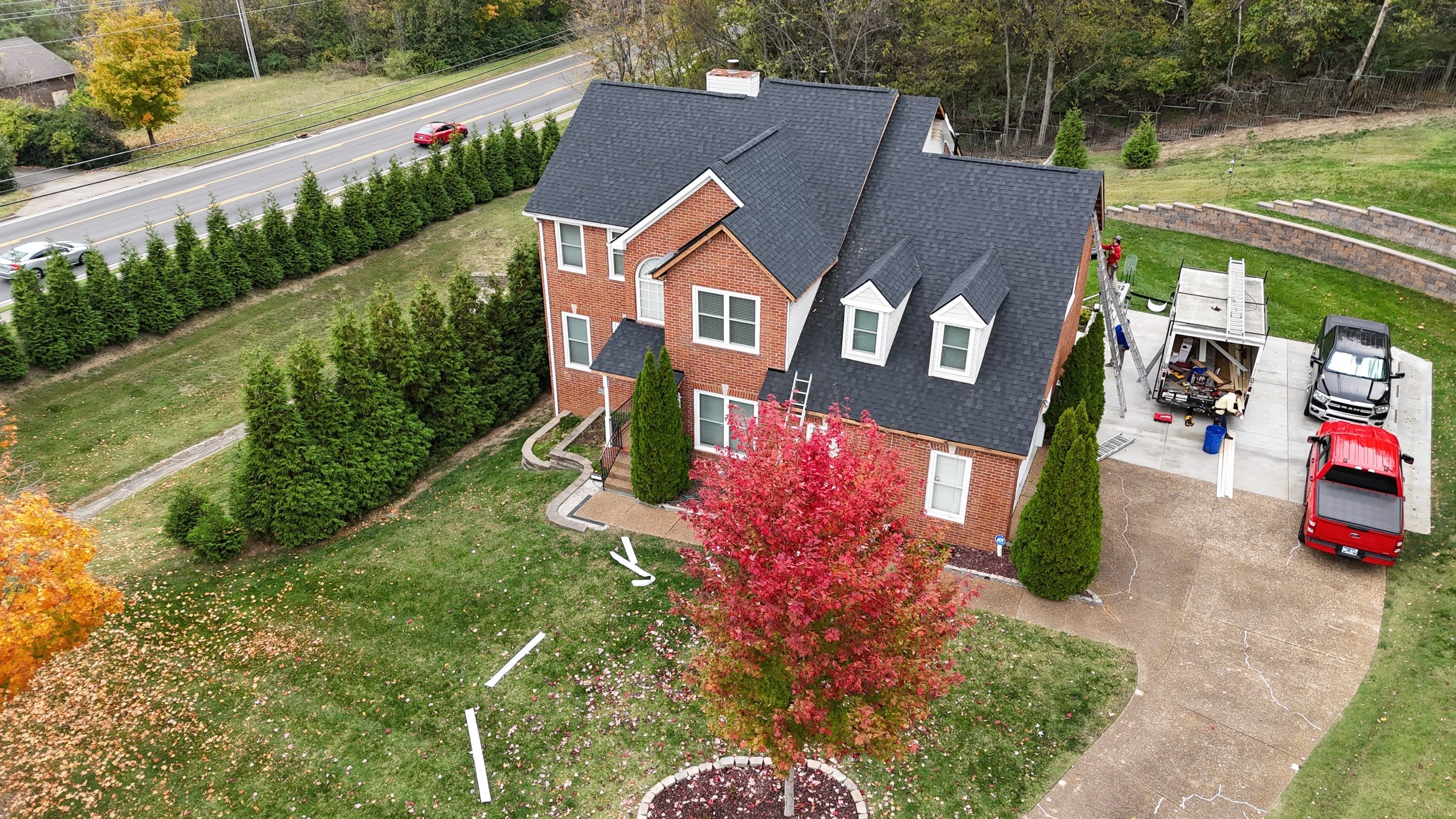 Charcoal Black Re-Roof & Gutters by Royal House LLC