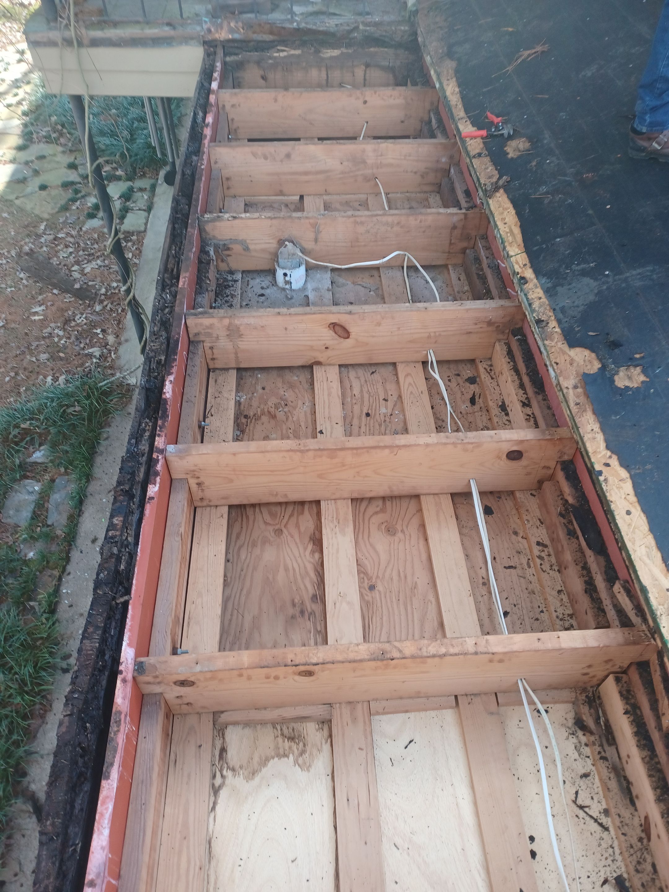 Residential Roofing Installation using PVC membrane and 24 gauge Standing Seam Metal by Hostetler Roofing
