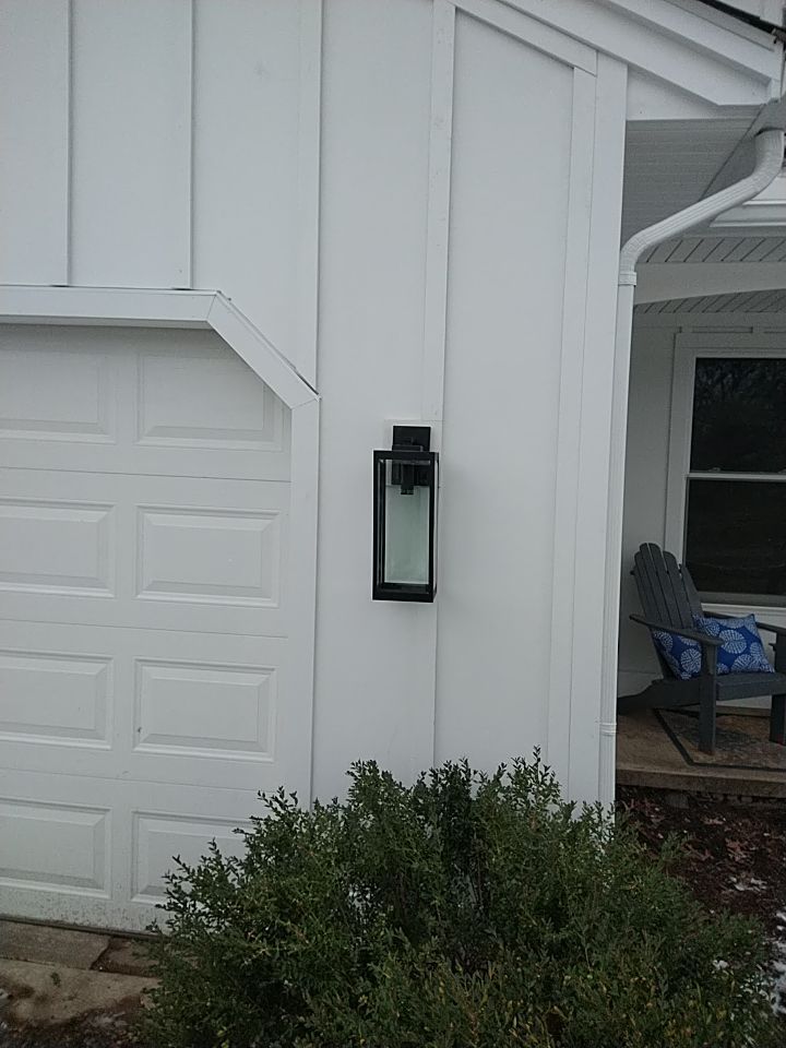 James Hardie Siding  using James Hardie Board and Batten, White by Absolute Roofing and Construction
