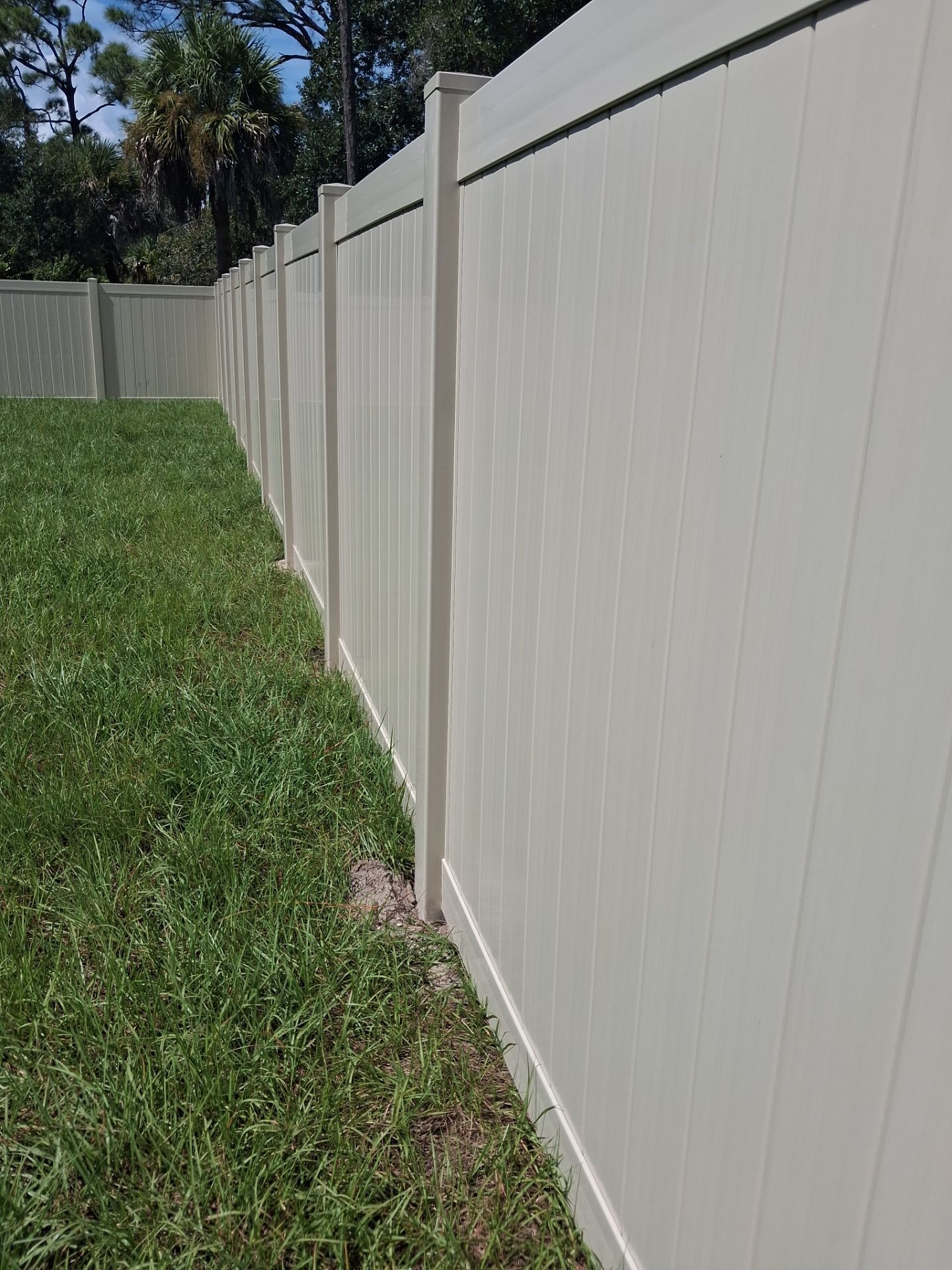 Tan Vinyl Privacy Fence and Gate Installation in Port Charlotte by True Fence LLC