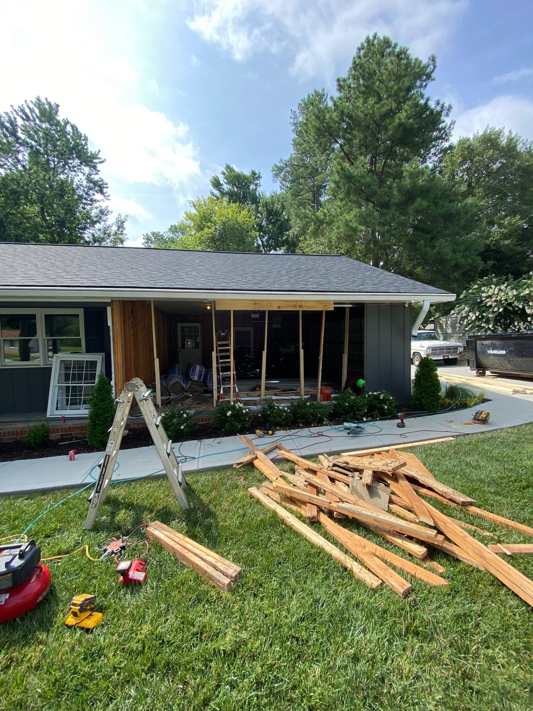 Snellville Garage Remodel Featuring Epoxy Floors and Board and Batten Siding by Swift Home Renovations
