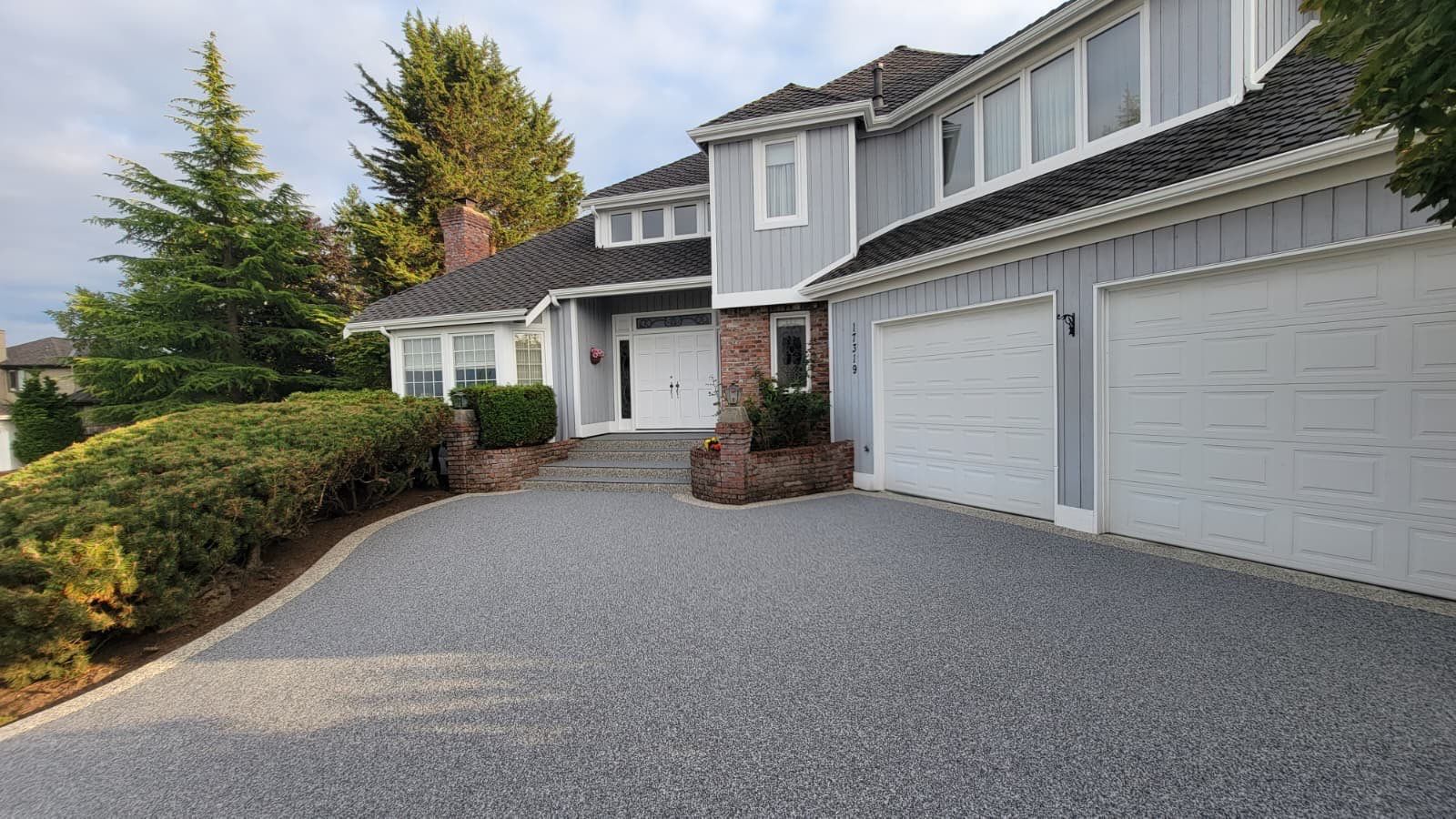 Elegant Driveway and Patio in Palazzo Vuba Stone by Concrete Coating Experts Inc.