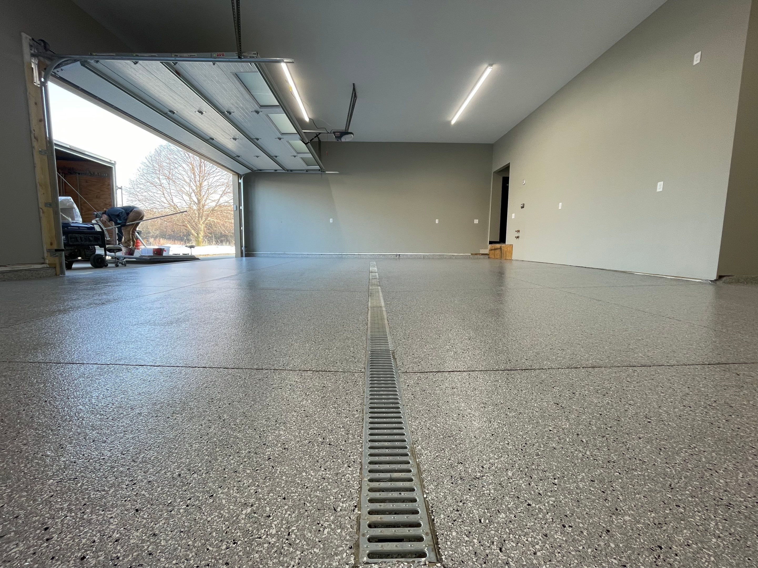 Decorative Flake Concrete Coating Installation in North Sioux City by Select Painting, Coatings & Garage Cabinets